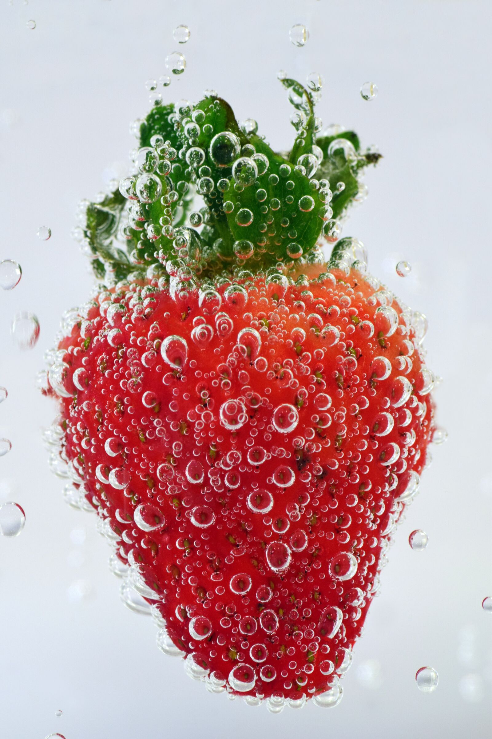 Nikon D3300 sample photo. Strawberry, water, blow photography