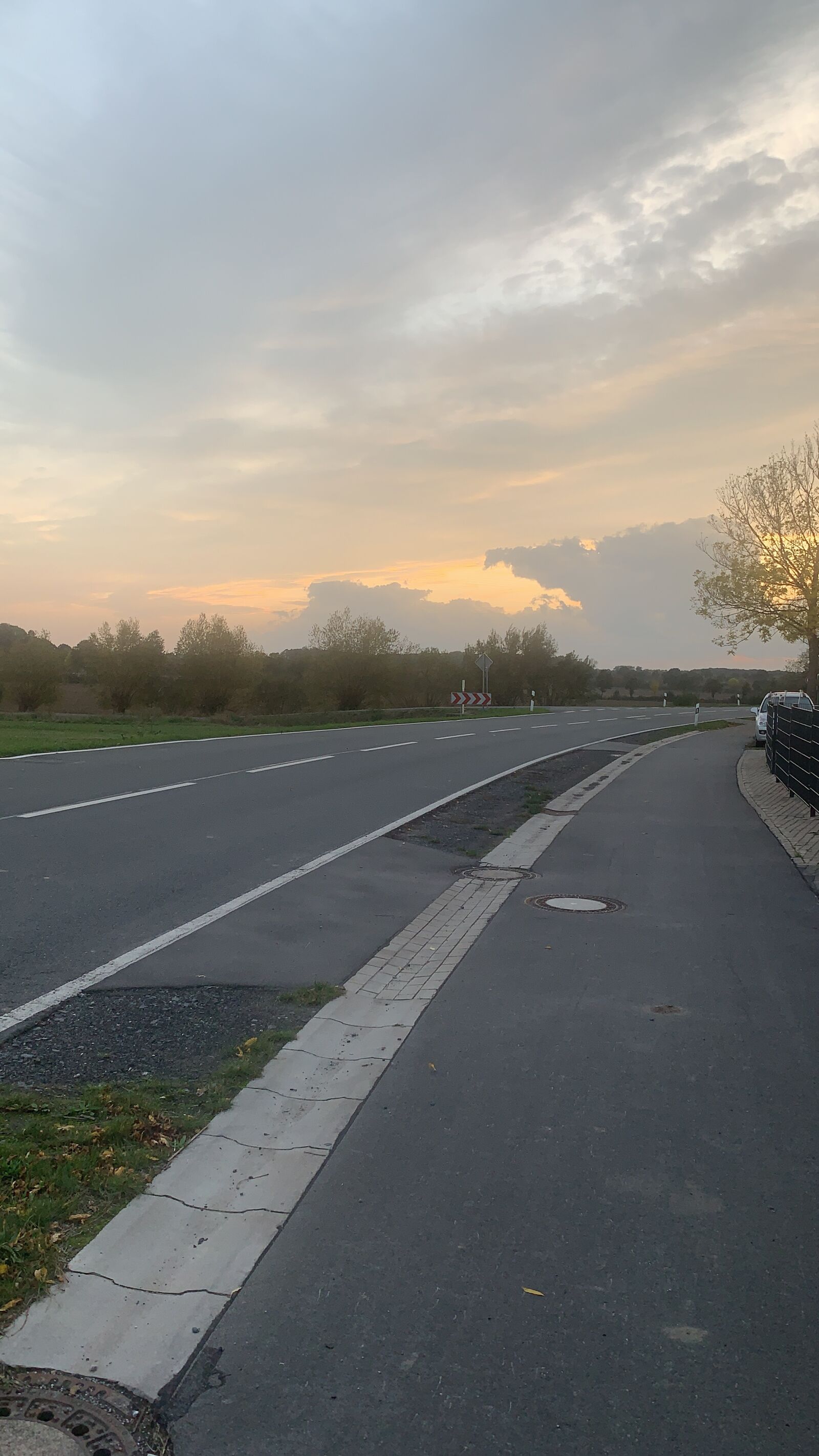 iPhone XS Max back camera 4.25mm f/1.8 sample photo. Road, cloud, trees photography