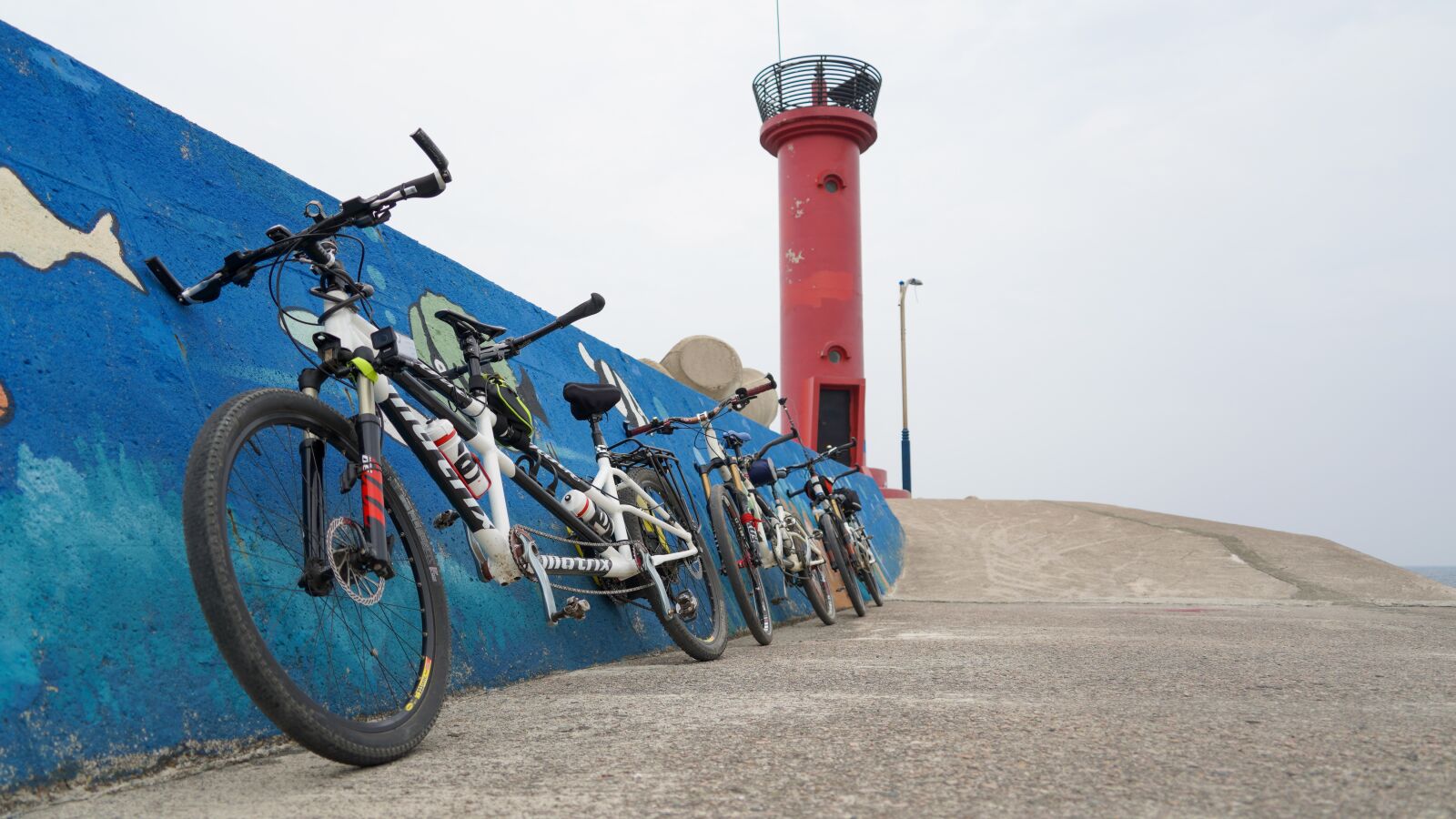 Sony a7 III + Sony FE 24-240mm F3.5-6.3 OSS sample photo. Bike, lighthouse, holiday photography