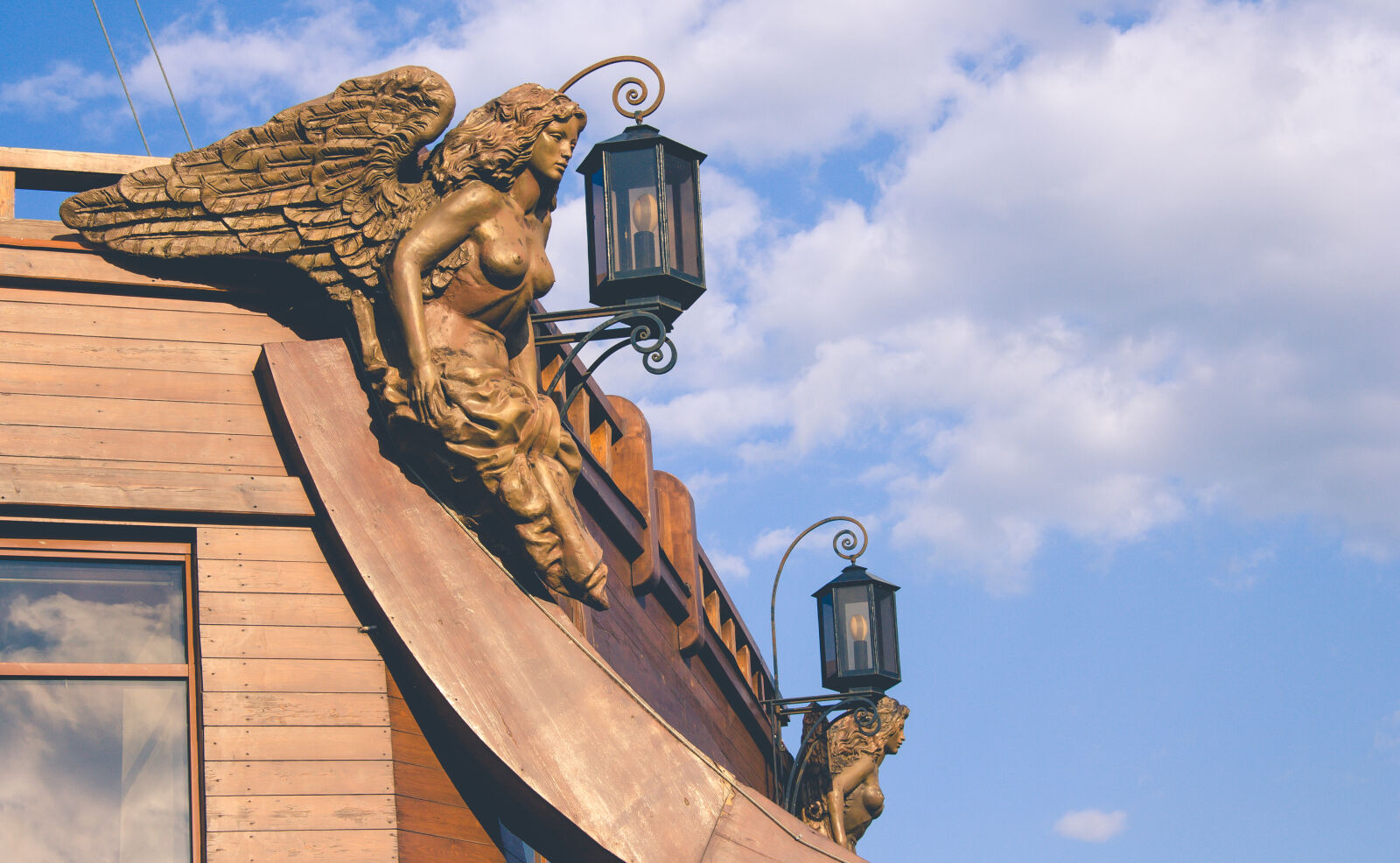 Canon EF-S 17-85mm F4-5.6 IS USM sample photo. Angel, boat, clouds, lantern photography