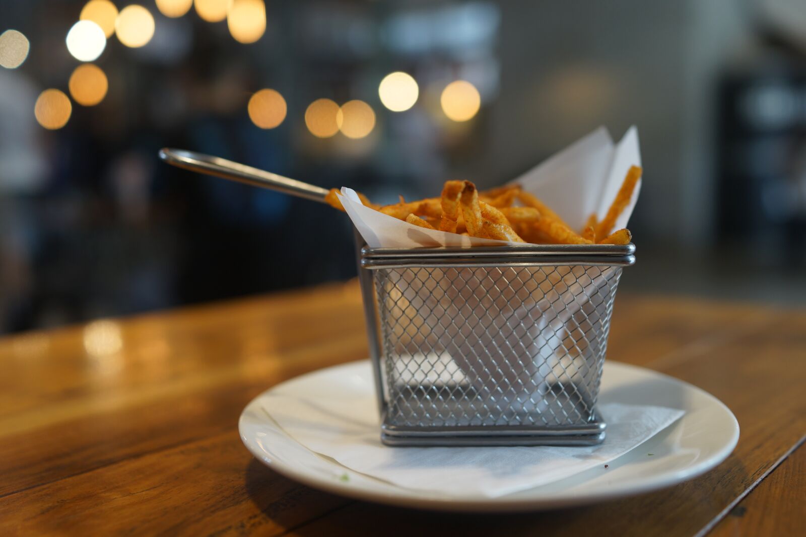 Sony Cyber-shot DSC-RX1R sample photo. French fries, basket, ambient photography