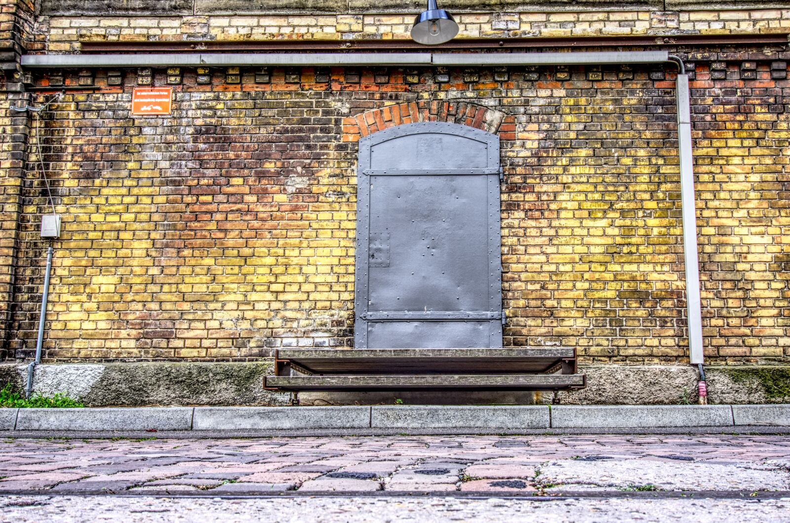 Sony E 16-50mm F3.5-5.6 PZ OSS sample photo. Industrial building, door, iron photography