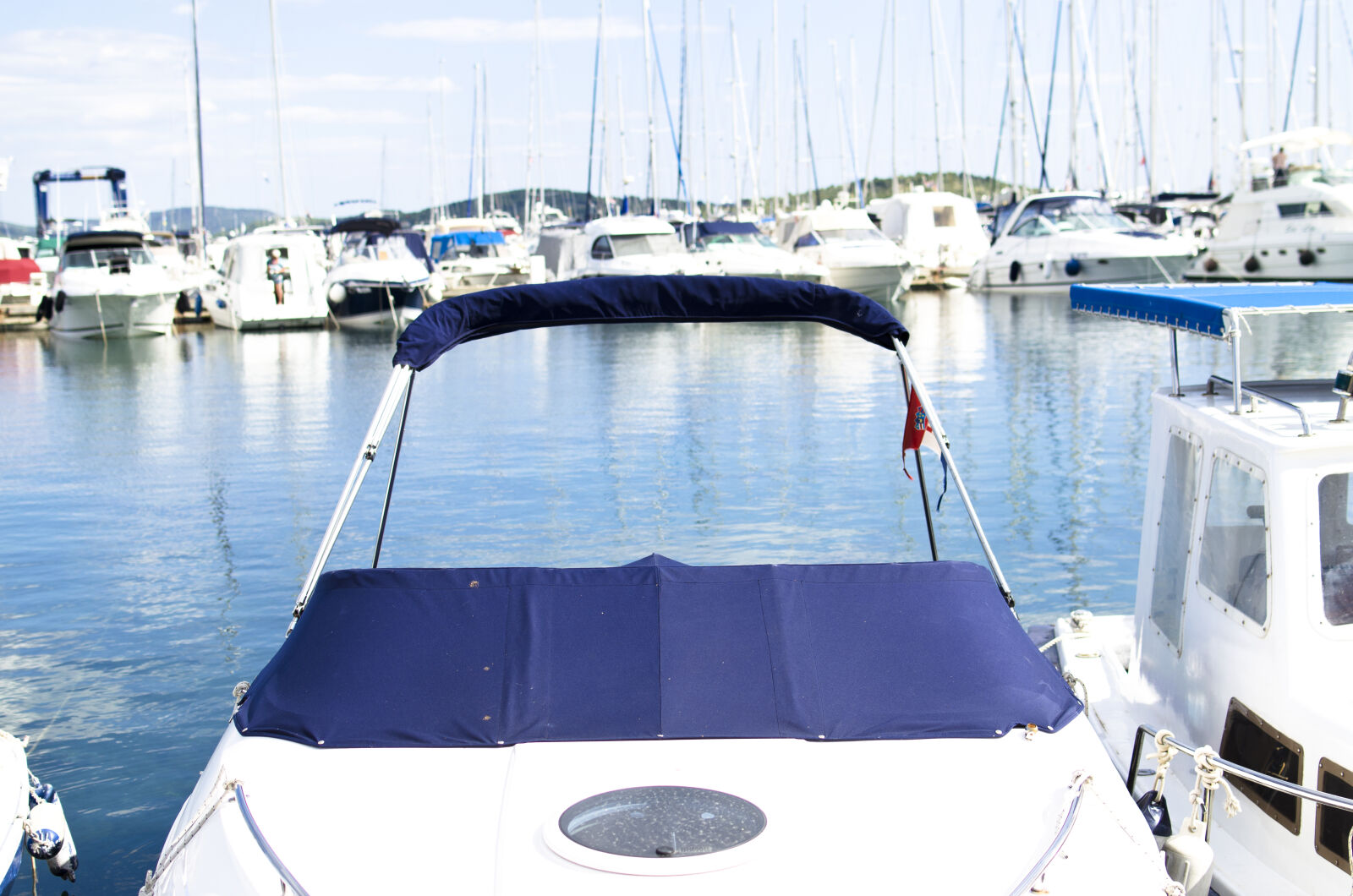 Nikon D5100 + Nikon AF-S DX Nikkor 35mm F1.8G sample photo. Bay, blue, boat, business photography