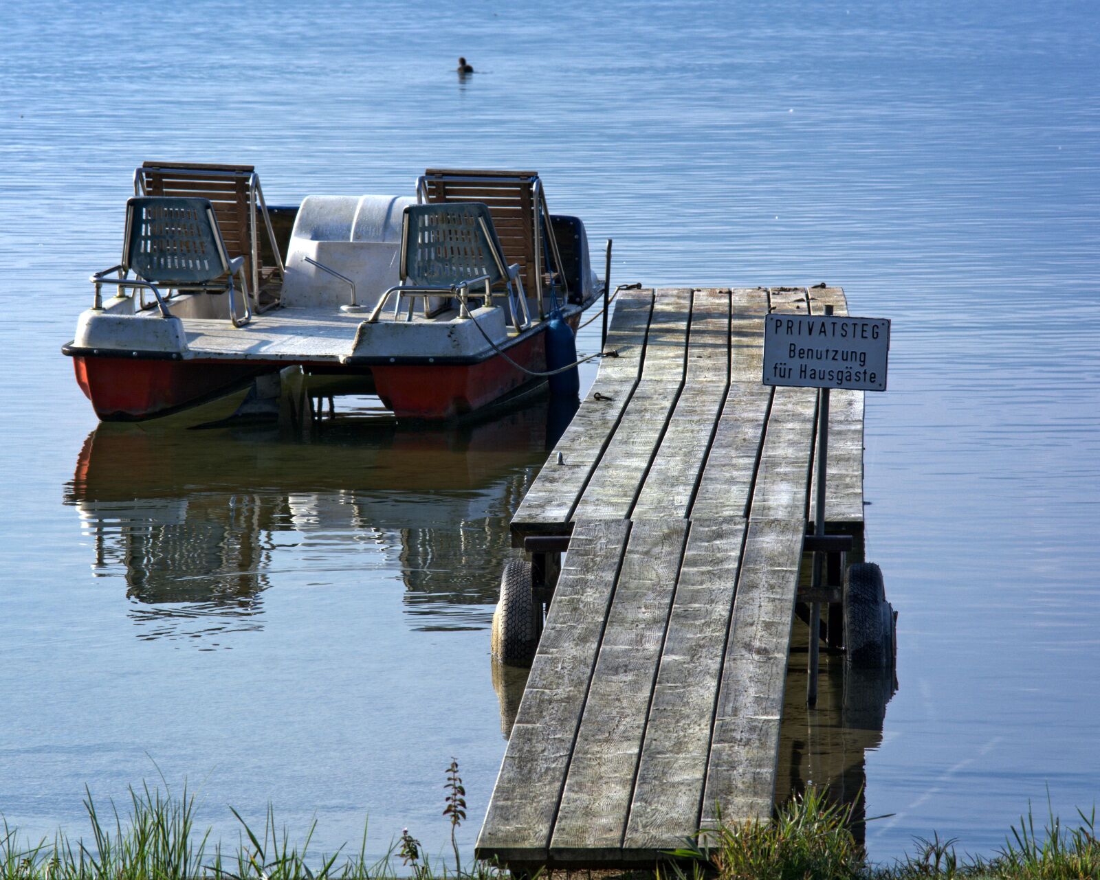 55.0-200.0mm f/4.0-f/5.6 sample photo. Pedal boat, jetty, boat photography