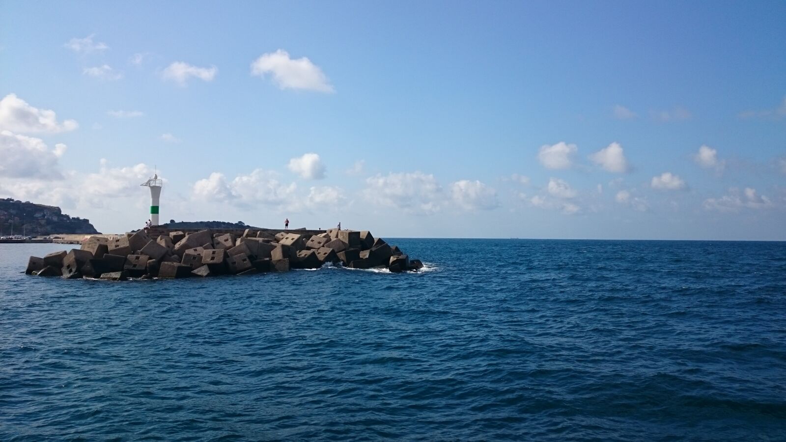 Sony Xperia Z1 sample photo. Blue sea, stones, lighthouse photography
