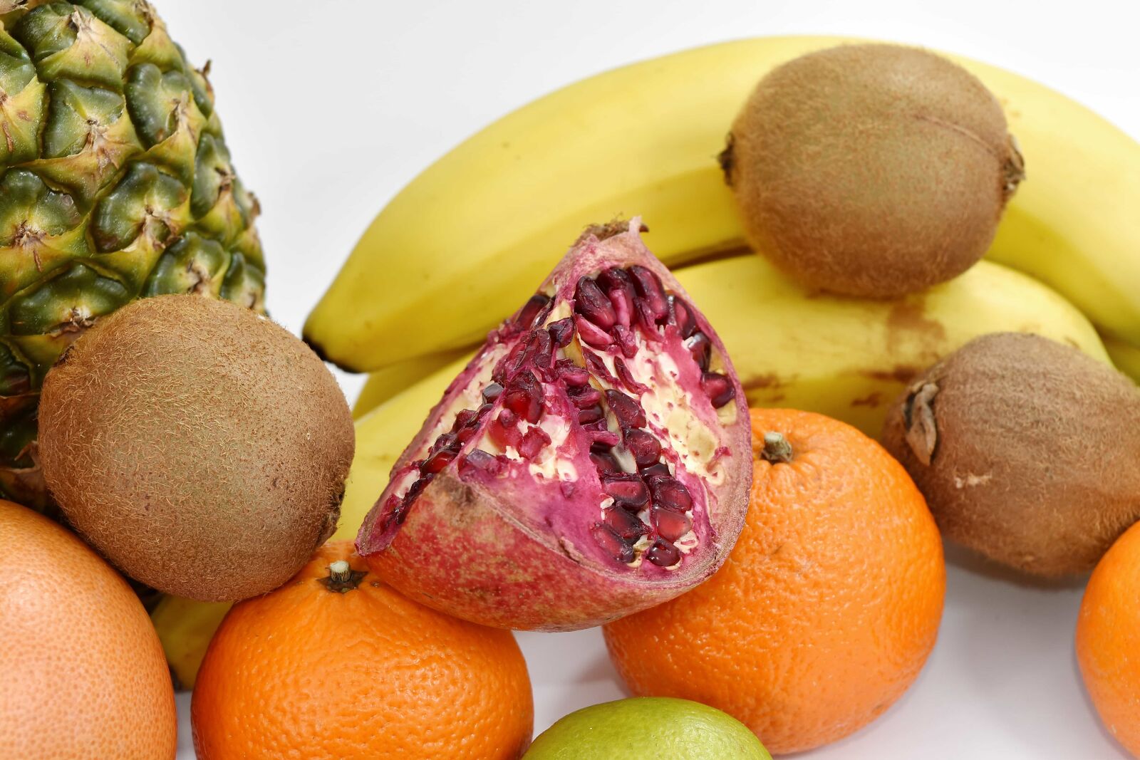 Nikon D5500 sample photo. Banana, pomegranate, seed, citrus photography
