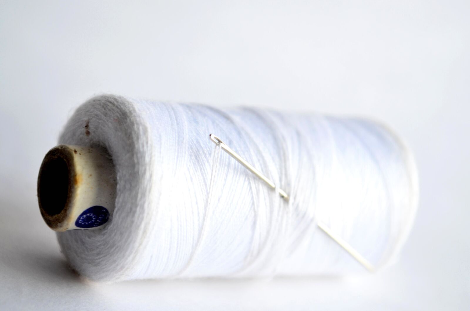 Nikon D5100 sample photo. White, sewing thread, sewing photography