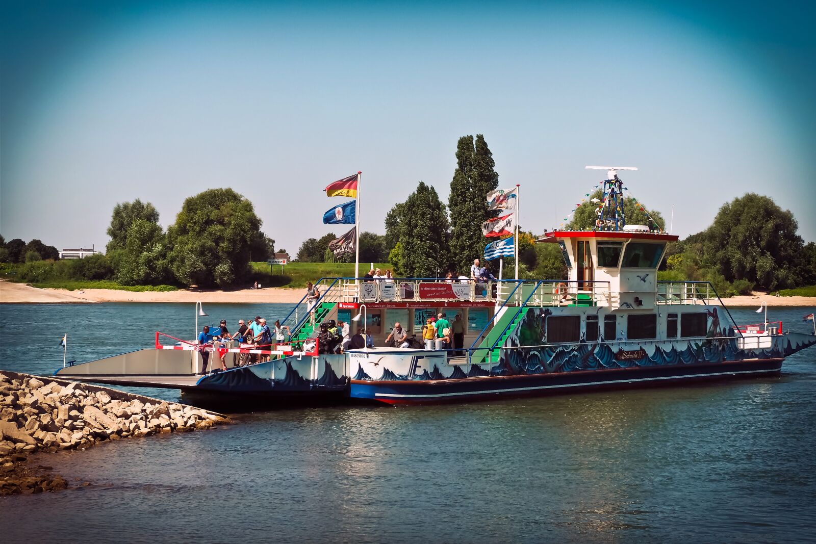 Olympus OM-D E-M10 sample photo. River, ferry, water photography