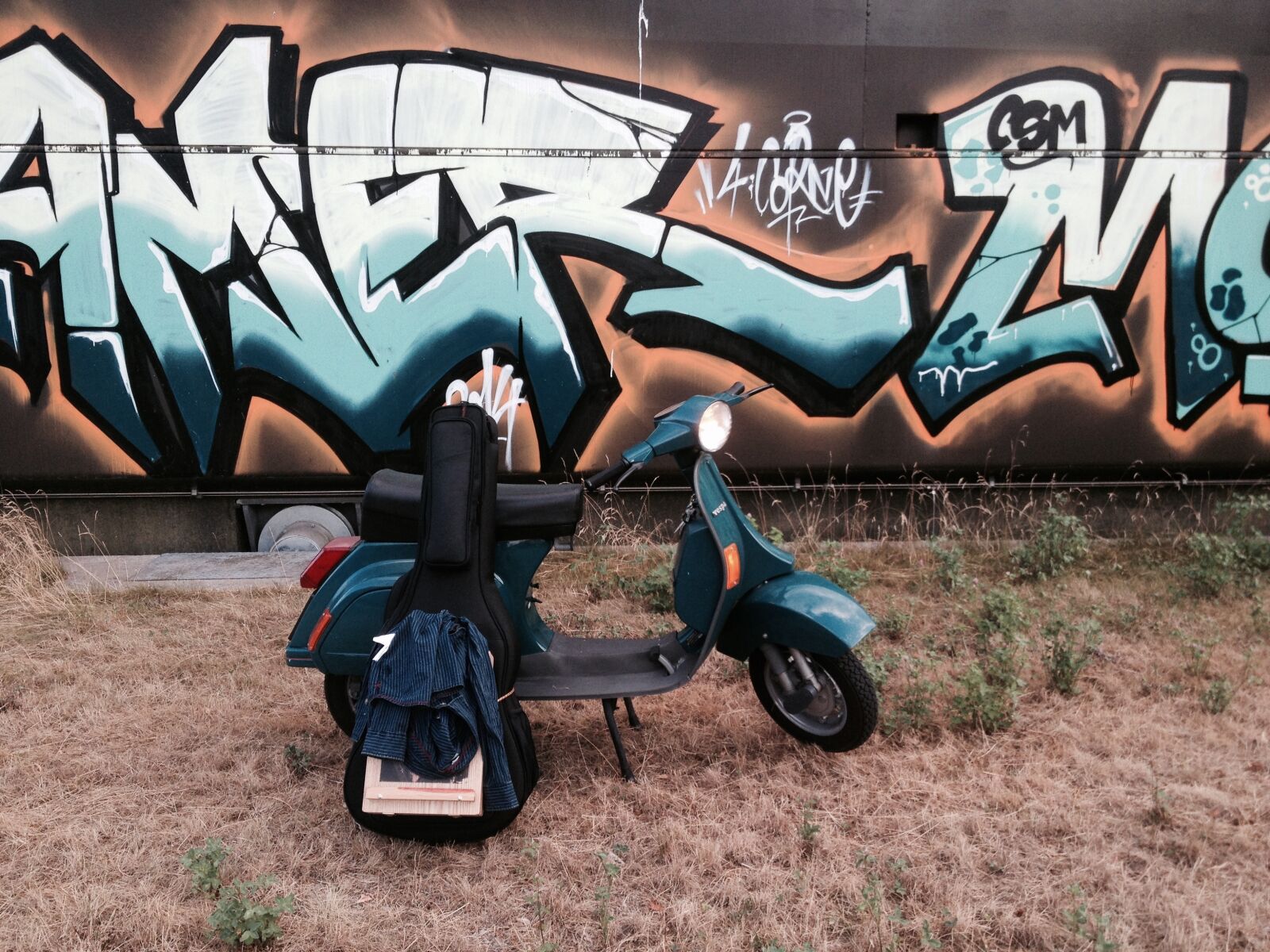 iPhone 4S back camera 4.28mm f/2.4 sample photo. Vespa, graffiti, rock photography
