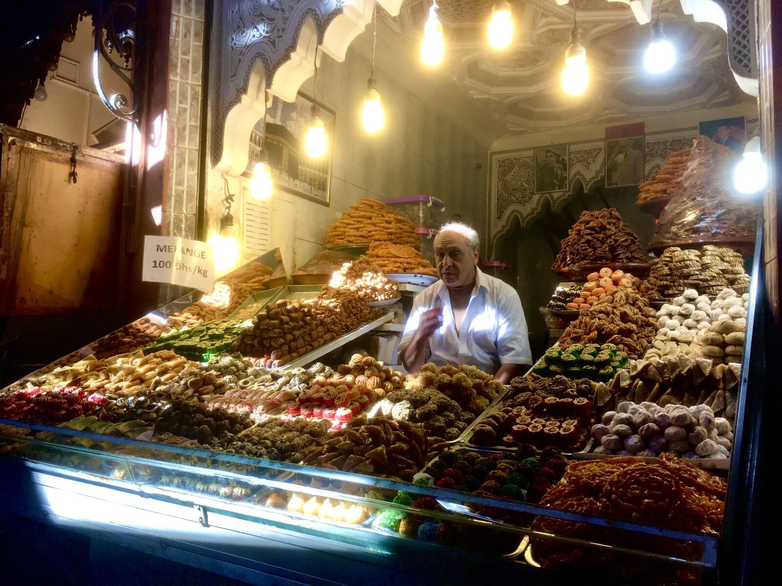 iPhone SE back camera 4.15mm f/2.2 sample photo. Morocco, market, vendor photography