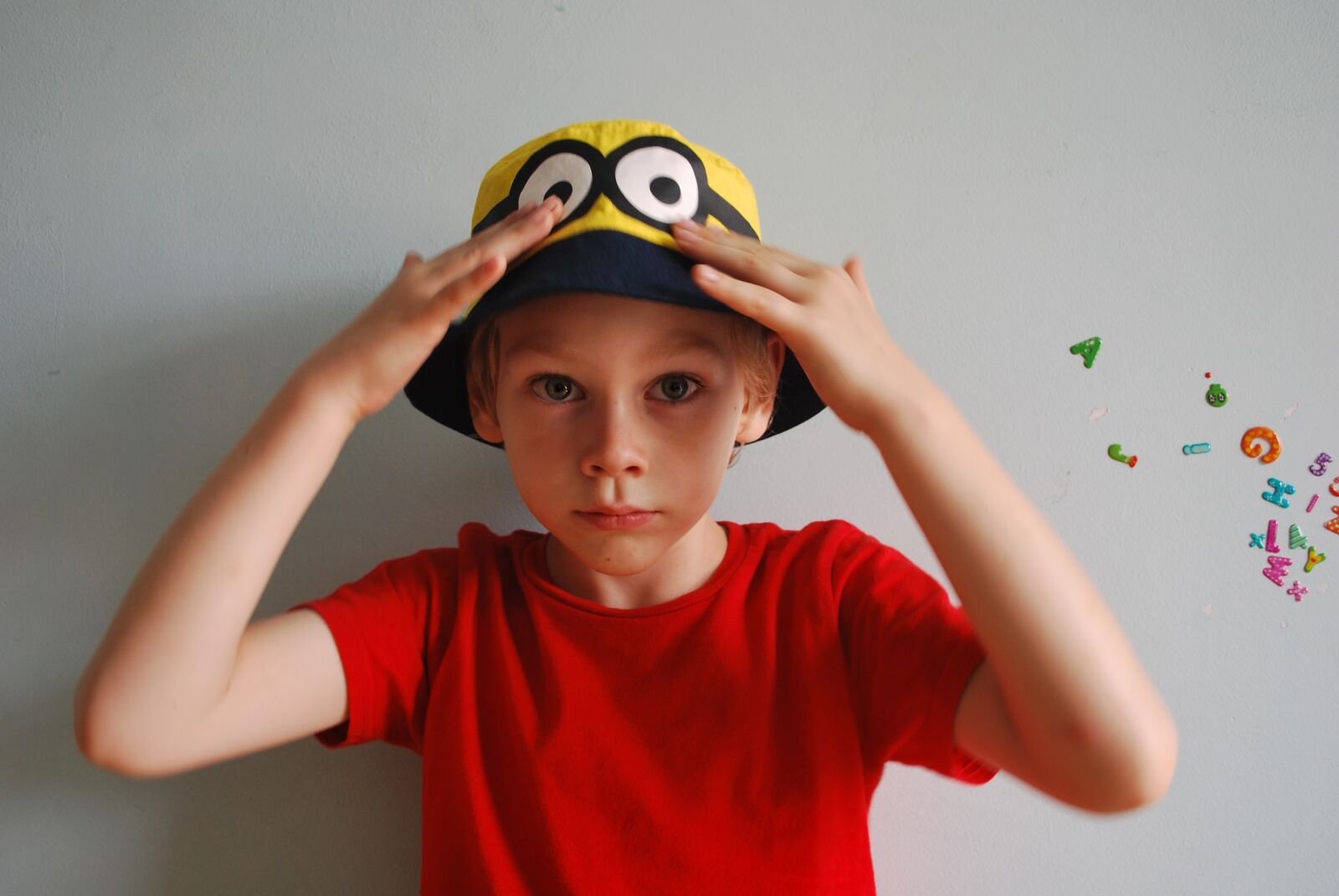 Nikon D60 sample photo. Boy, cap, minion photography