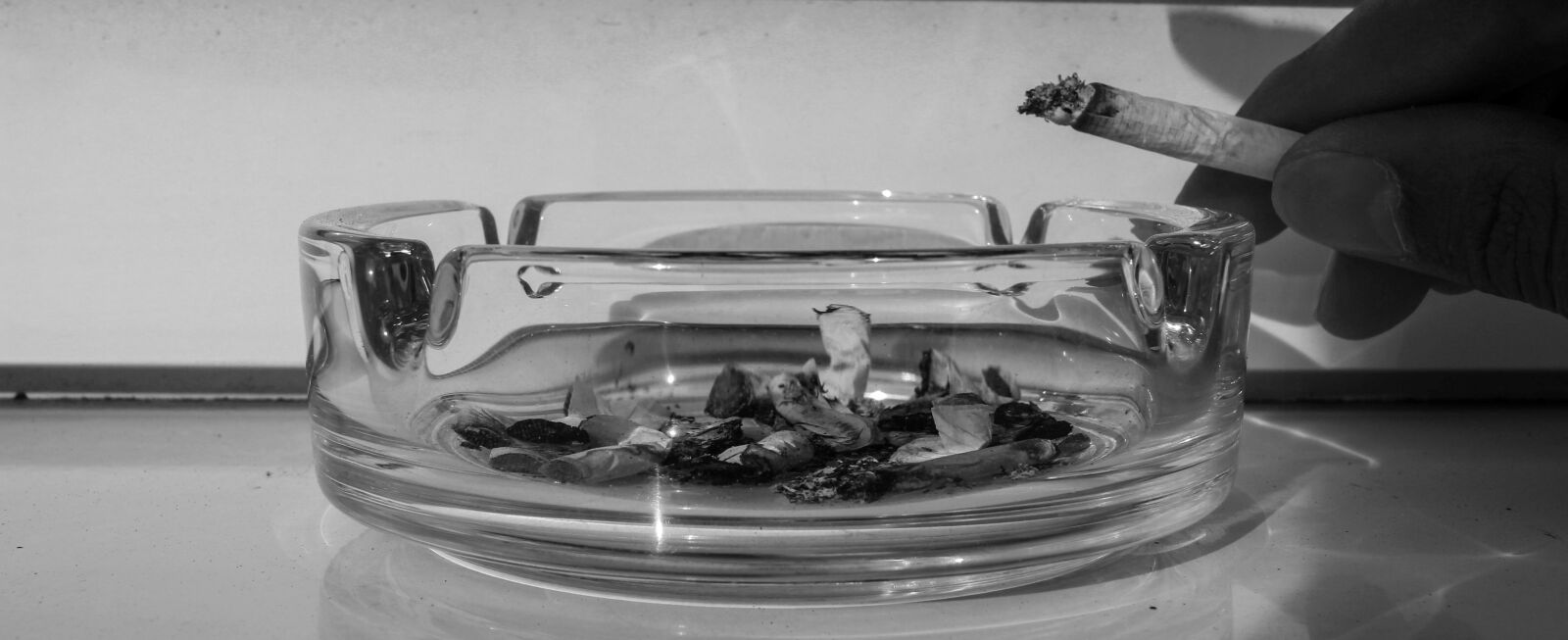 Canon EF-S 24mm F2.8 STM sample photo. Cigarette, ashtray, smoking photography
