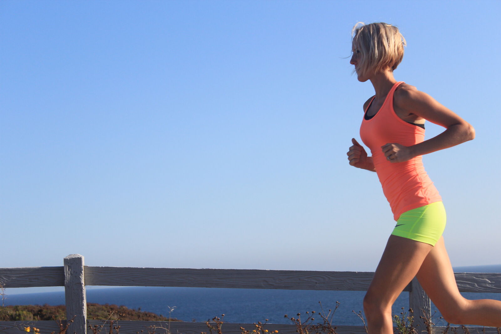 Canon EOS 600D (Rebel EOS T3i / EOS Kiss X5) sample photo. Woman, in, orange, tank photography