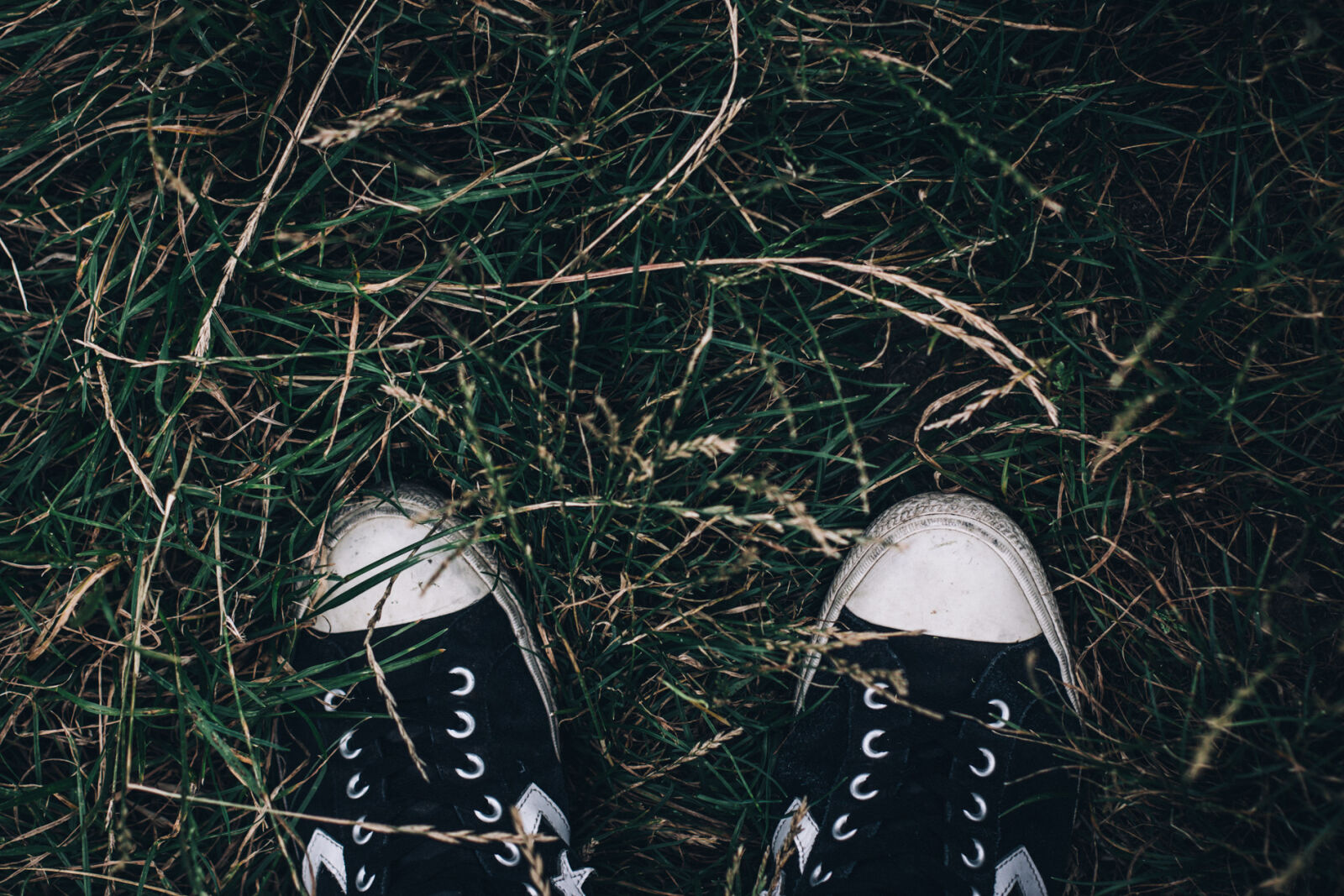 Canon EOS 70D + Canon EF 50mm F1.4 USM sample photo. Conceptual, dark, dirty, footwear photography