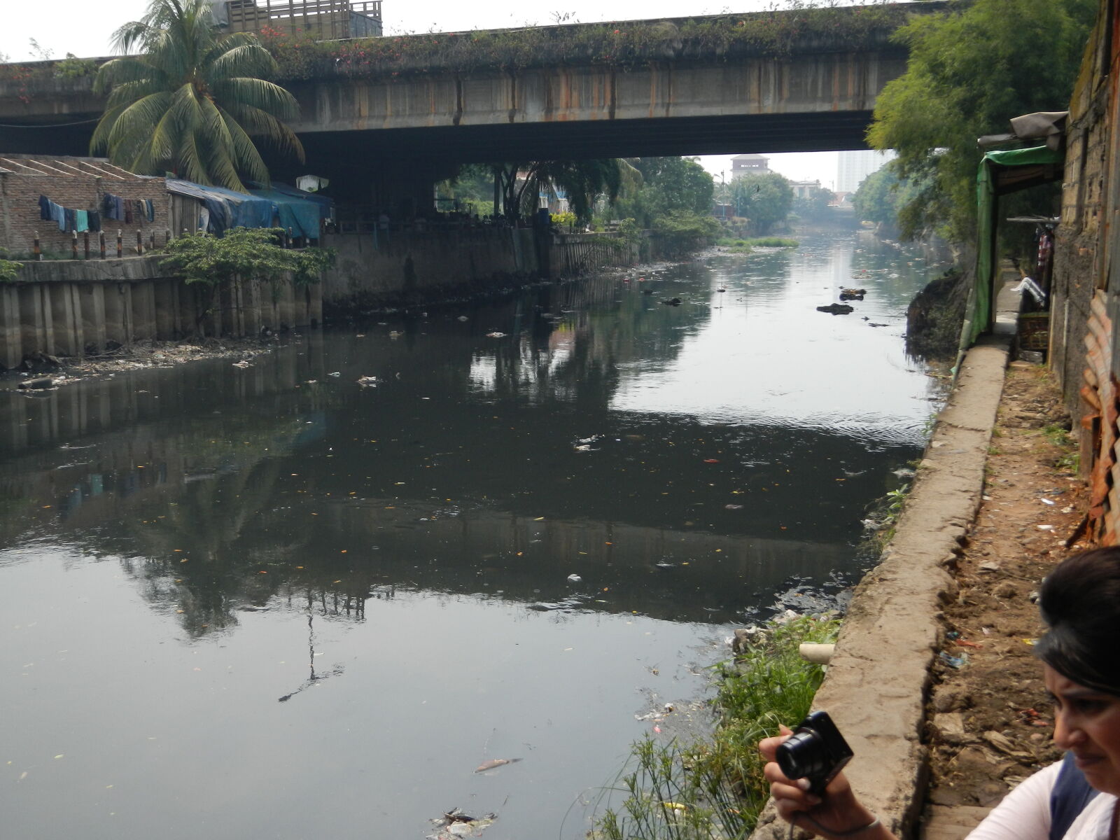 Nikon Coolpix AW100 sample photo. Pollution, river, slums photography
