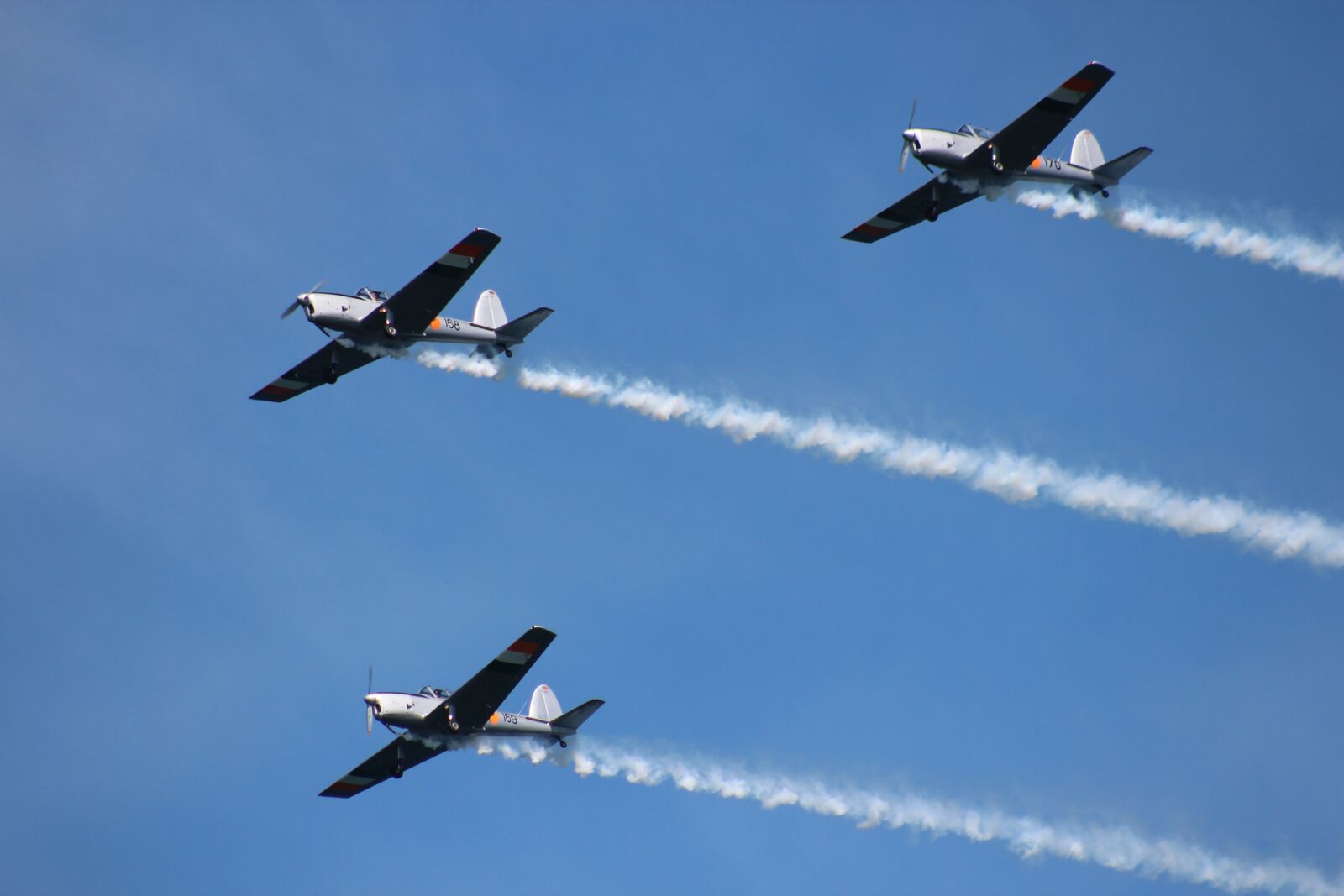 Canon EF 75-300mm f/4-5.6 USM sample photo. Airplane, airshow, smoke photography