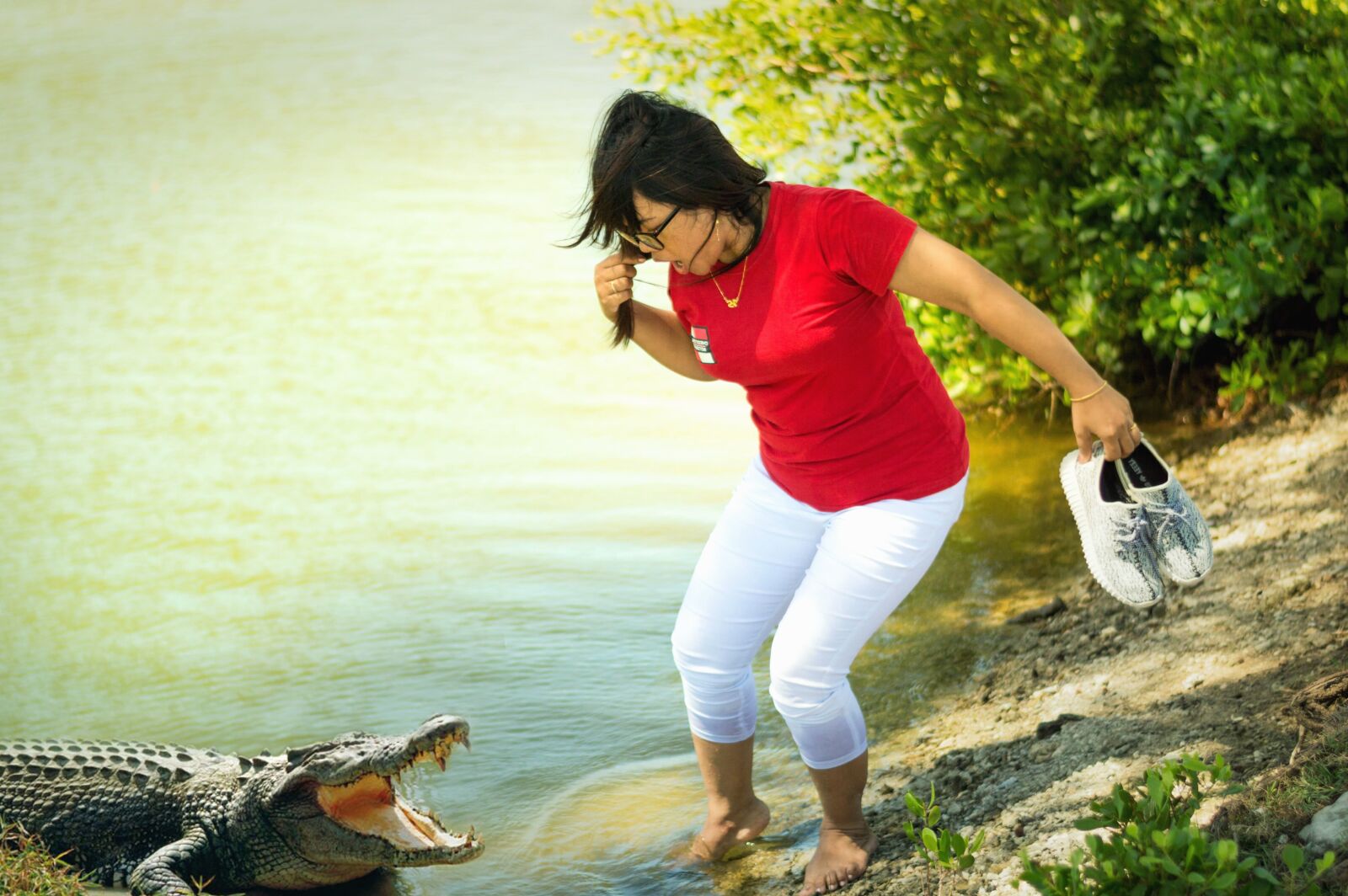 Nikon D3200 sample photo. Woman, alligator, water, danger photography