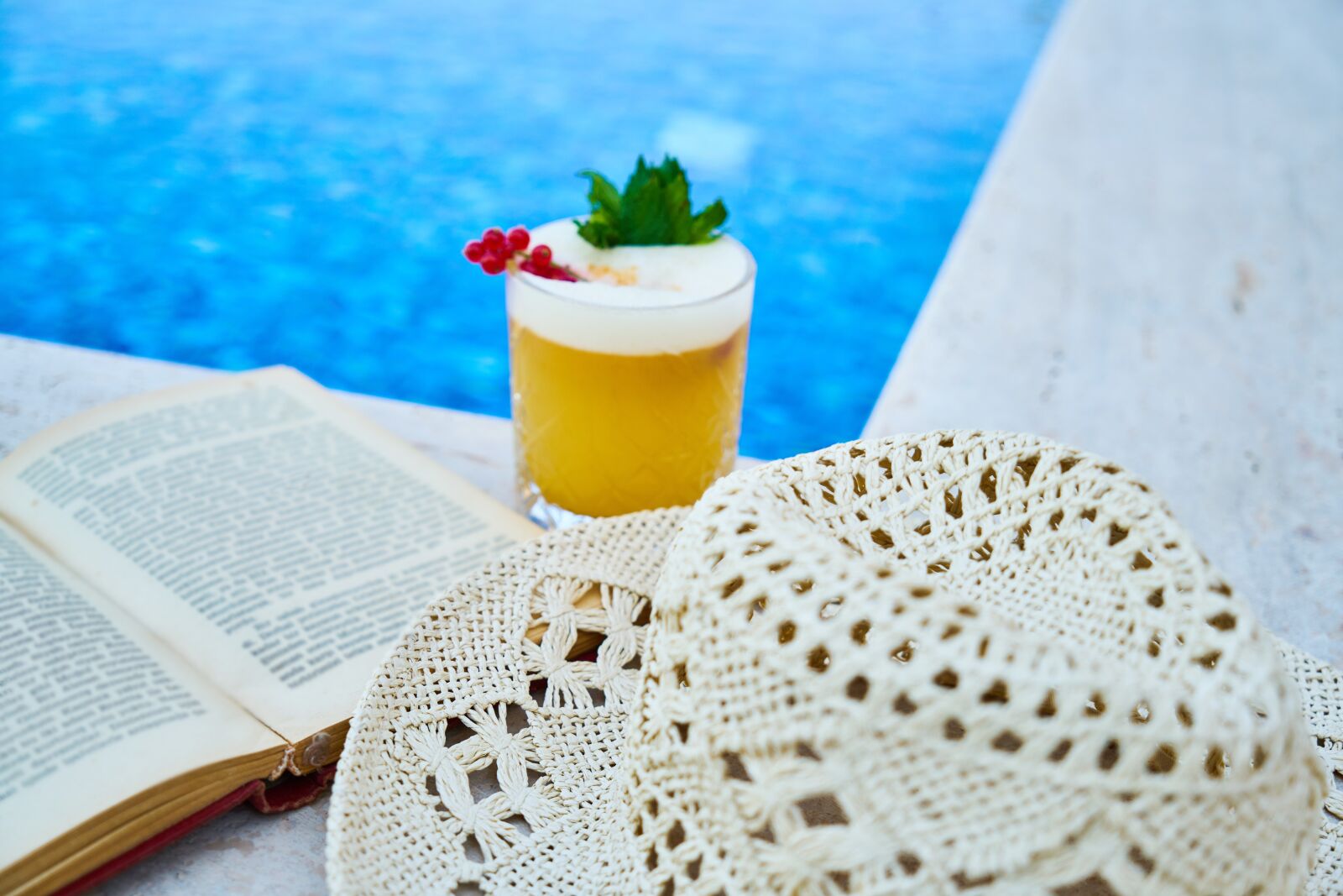 Sony a7R II sample photo. Cocktail, book, pool photography