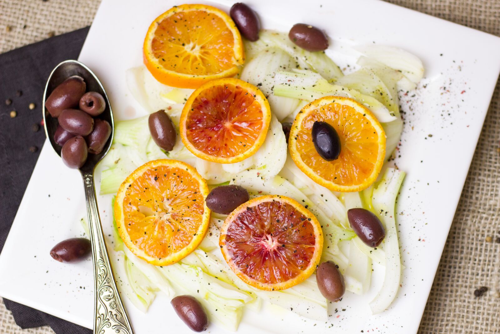 Canon EOS 600D (Rebel EOS T3i / EOS Kiss X5) + Canon EF 50mm F1.8 STM sample photo. Olives, orange, fennel photography
