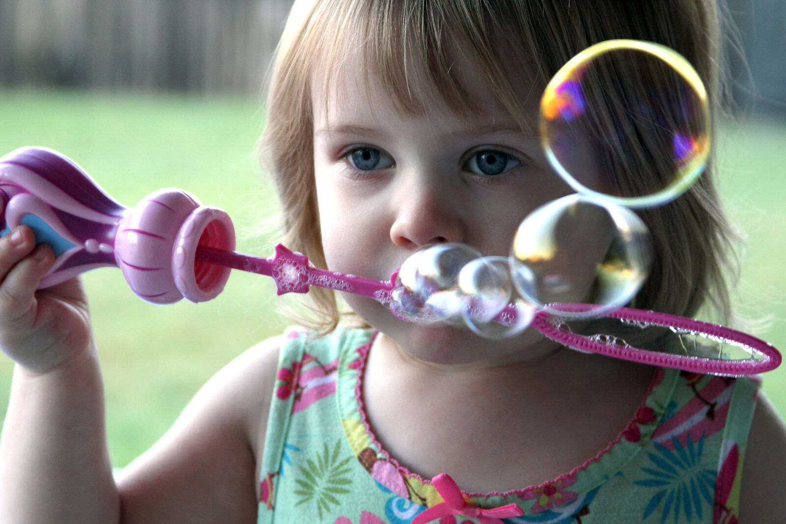 Canon EOS 7D + Canon EF 28-135mm F3.5-5.6 IS USM sample photo. Blowing, bubbles, child photography
