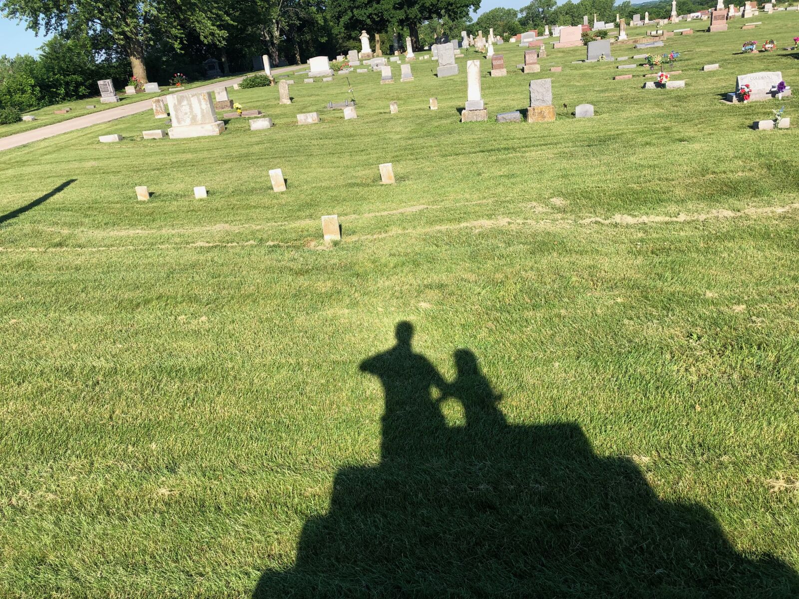 iPhone X back dual camera 4mm f/1.8 sample photo. Cemetery, shadow, grave photography