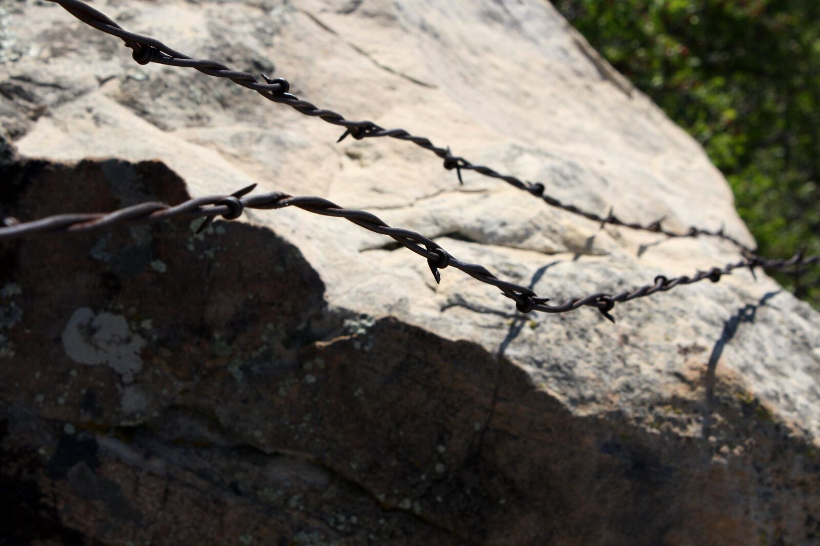 f/3.5-5.6 IS sample photo. Barbed wire, rock photography