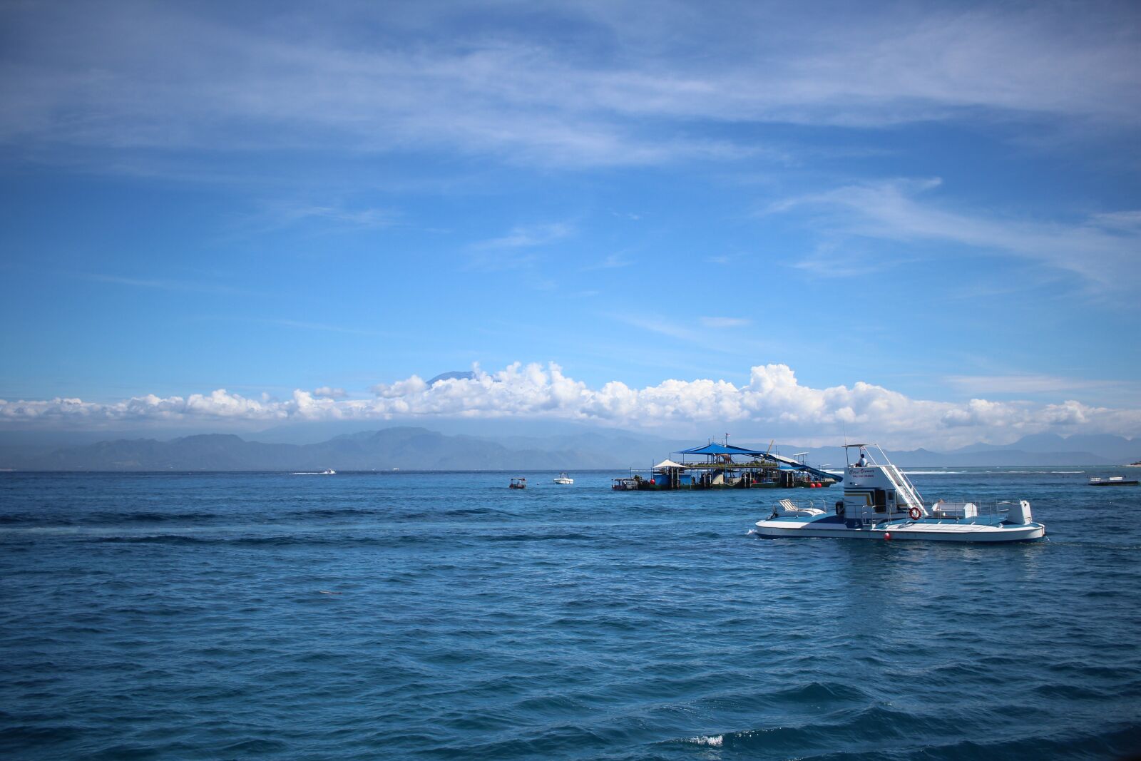 Canon EF-S 24mm F2.8 STM sample photo. Sea, blue sky, yacht photography