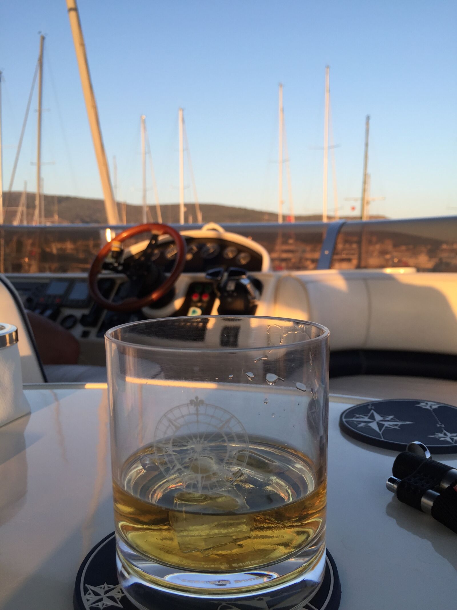 iPhone 6 back camera 4.15mm f/2.2 sample photo. Glass, lighter, marina, whiskey photography