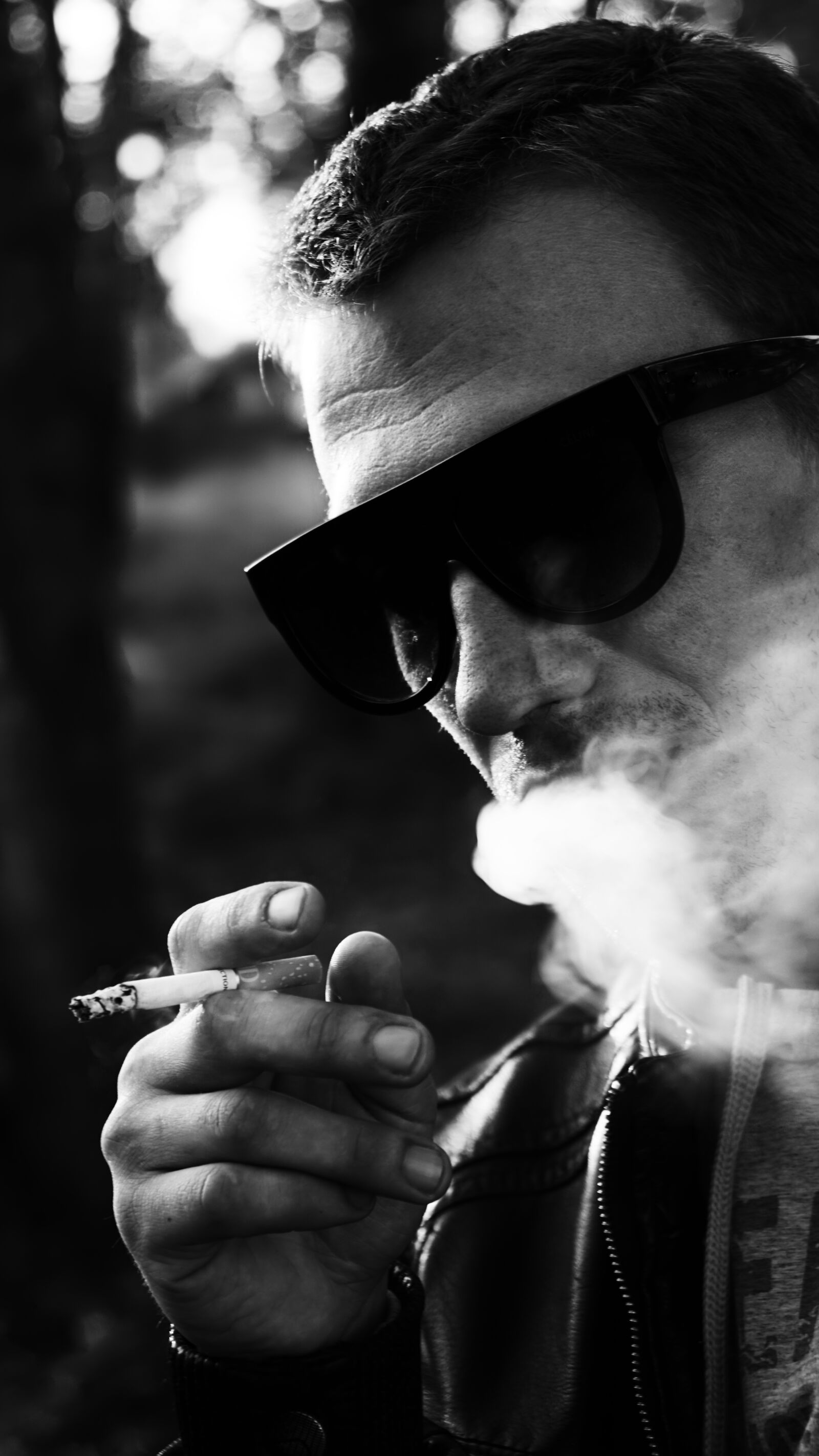 Sony a6000 + Sony Vario-Tessar T* E 16-70mm F4 ZA OSS sample photo. Glasses, smoke, smoking photography
