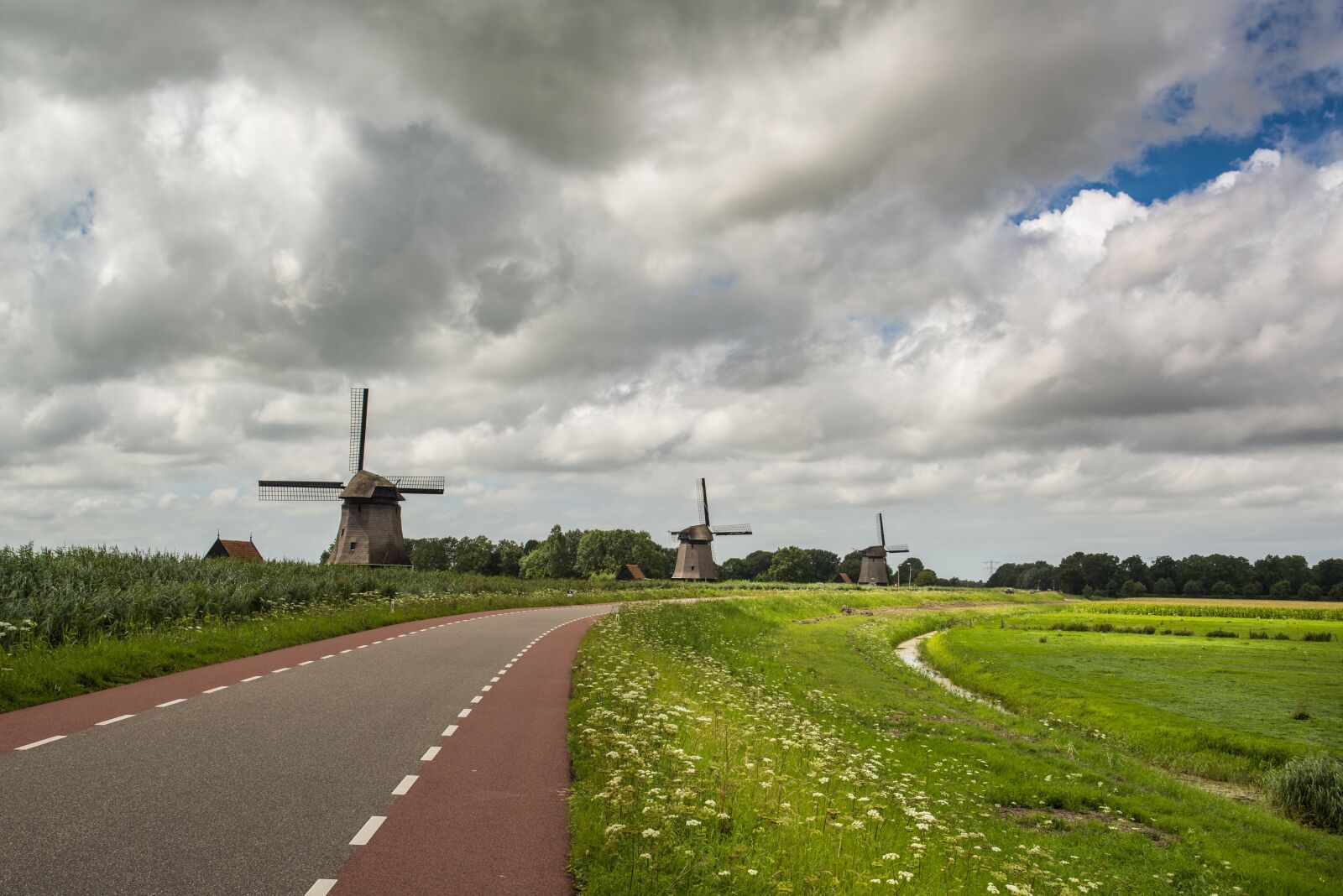 Nikon D600 sample photo. Windmills, pond, clouds photography