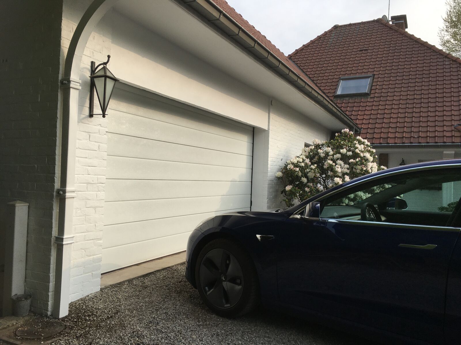 Apple iPhone 6s sample photo. Garage door, car, sectional photography