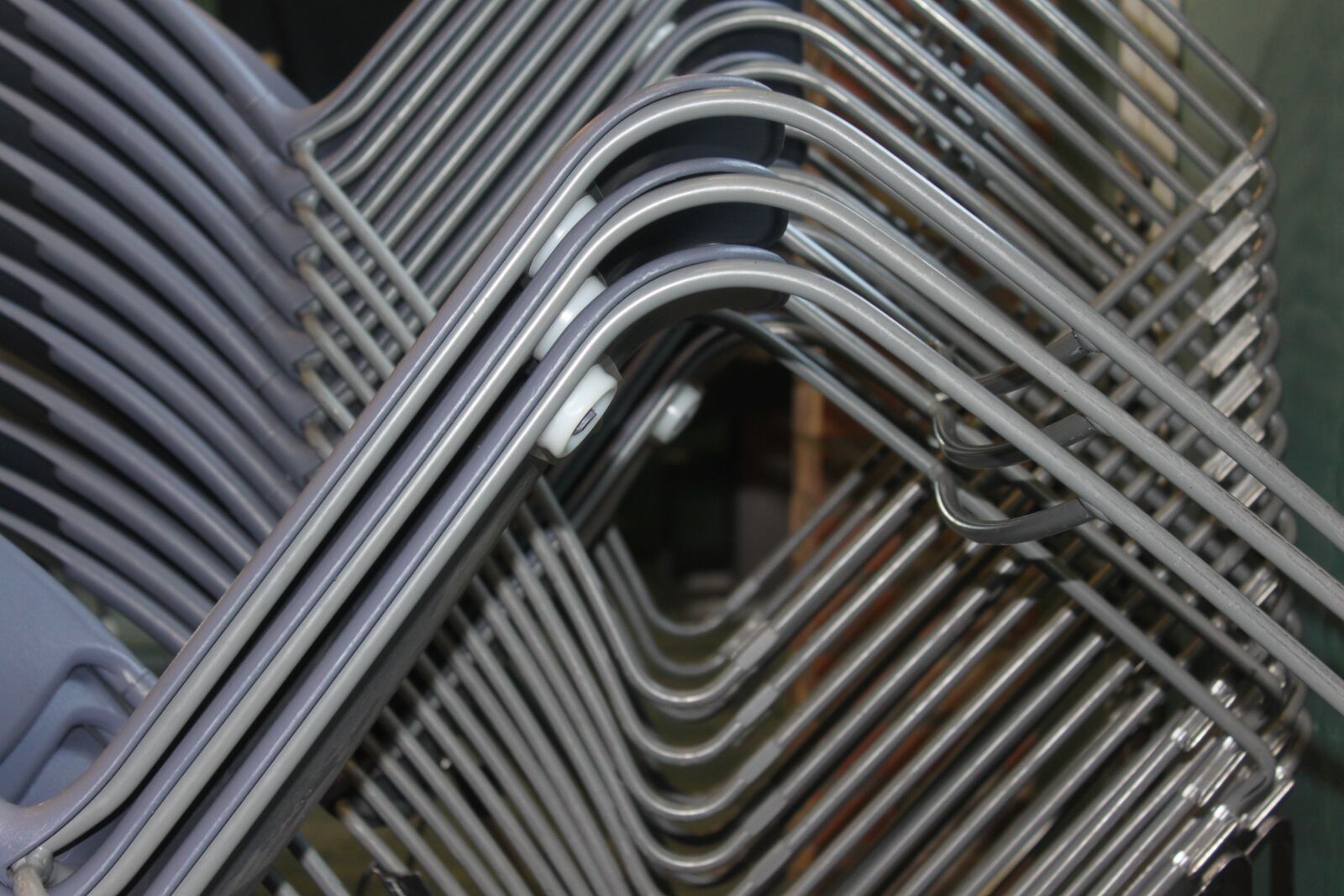 Canon EOS 500D (EOS Rebel T1i / EOS Kiss X3) sample photo. Chairs, stacked, geometric photography