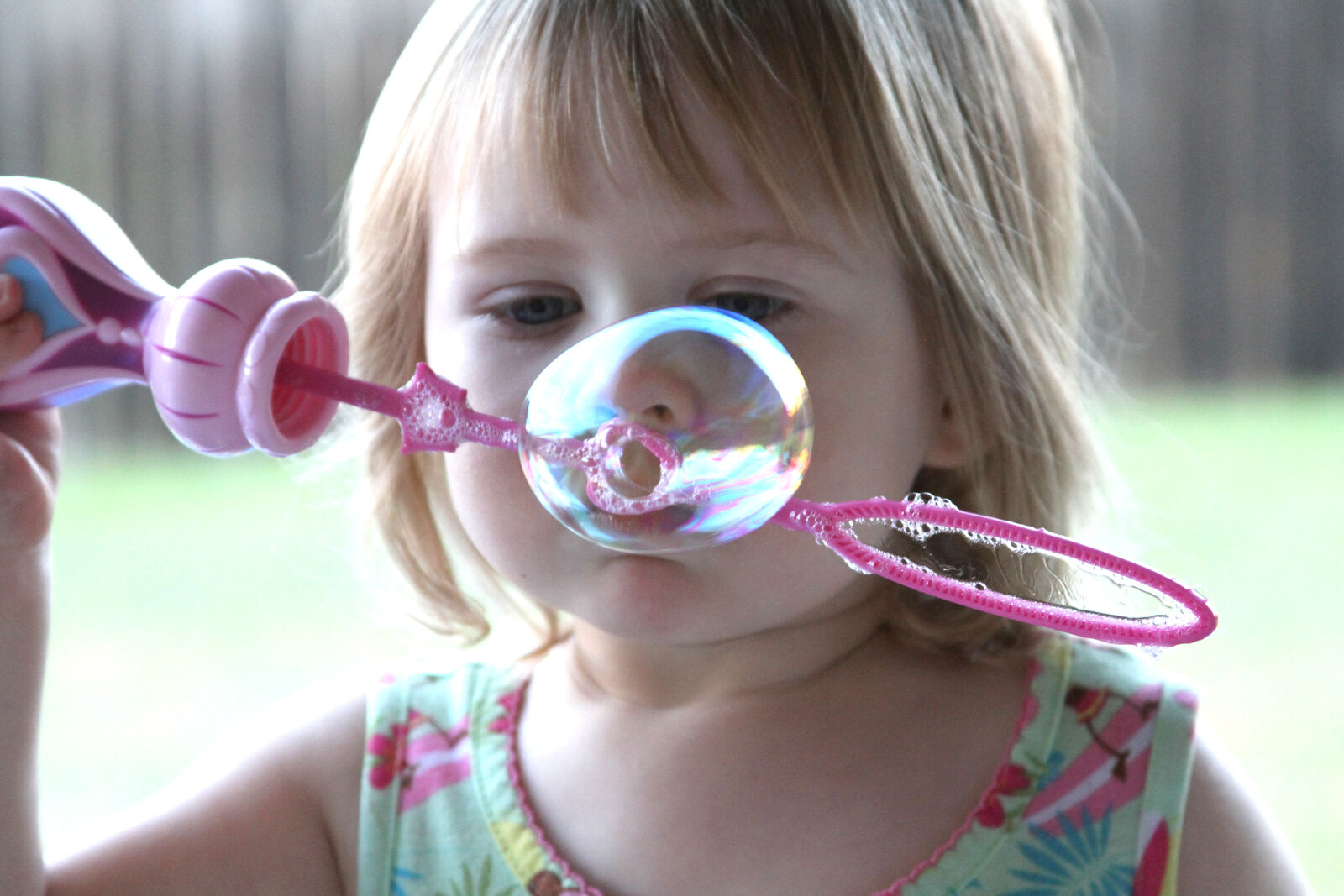 Canon EOS 7D + Canon EF 28-135mm F3.5-5.6 IS USM sample photo. Blowing, bubbles, child photography