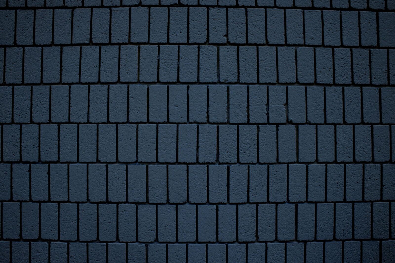 Canon EOS 1000D (EOS Digital Rebel XS / EOS Kiss F) + f/3.5-5.6 IS sample photo. Dark blue bricks, wall photography