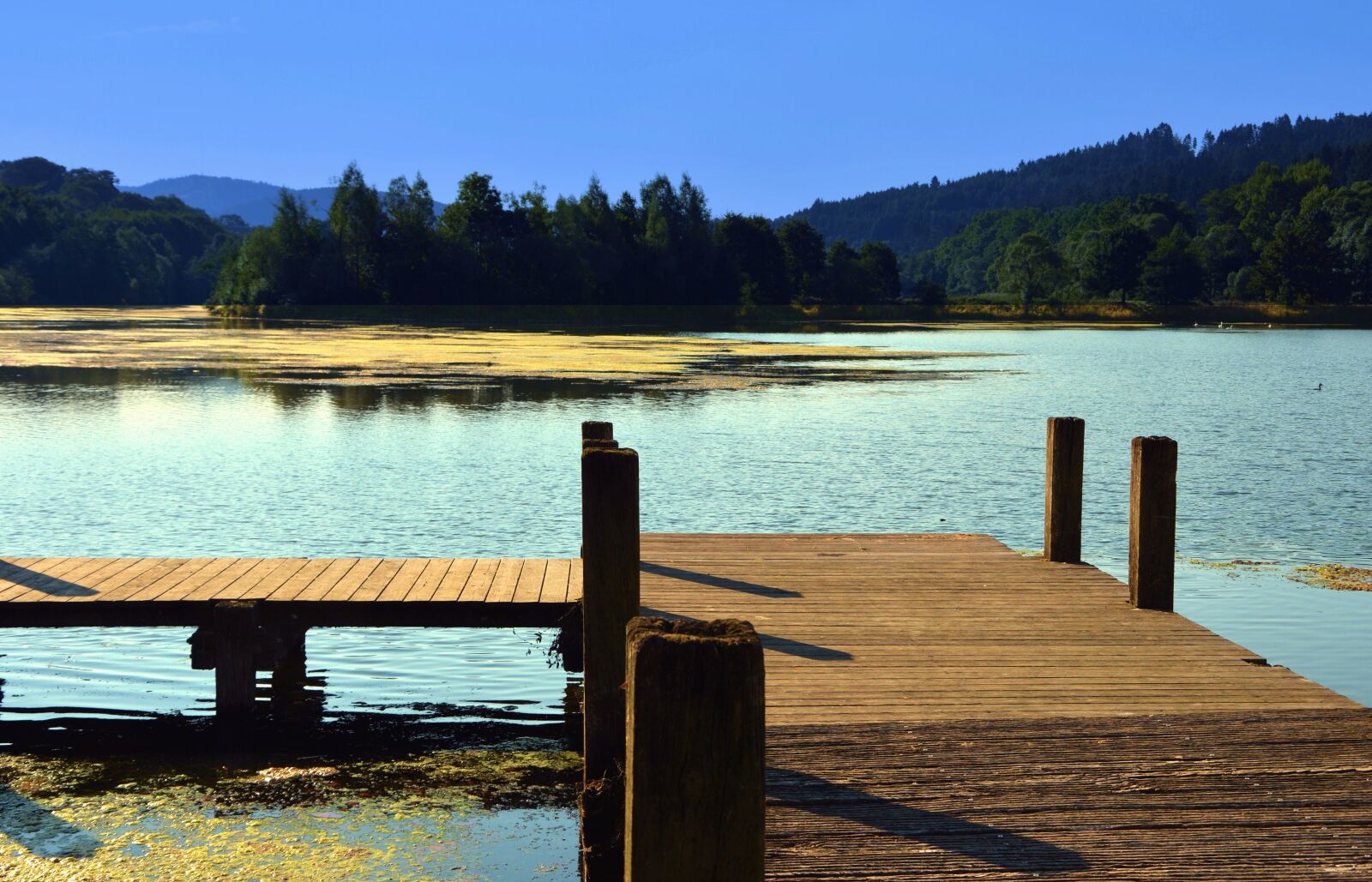 Nikon D5200 sample photo. Mountain, lake, dock, water photography