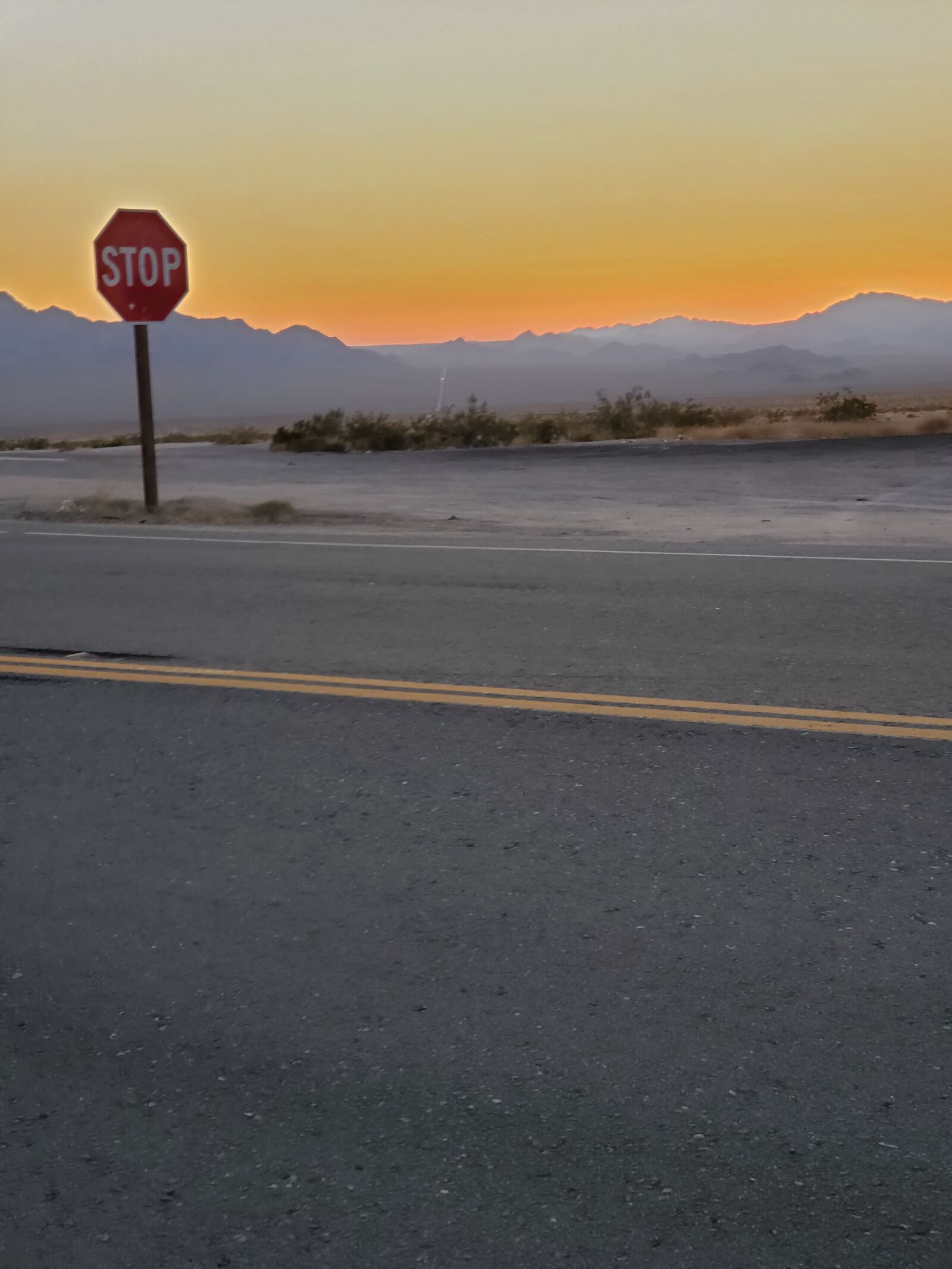 Samsung Galaxy S10+ sample photo. Road, sunset, stop sign photography