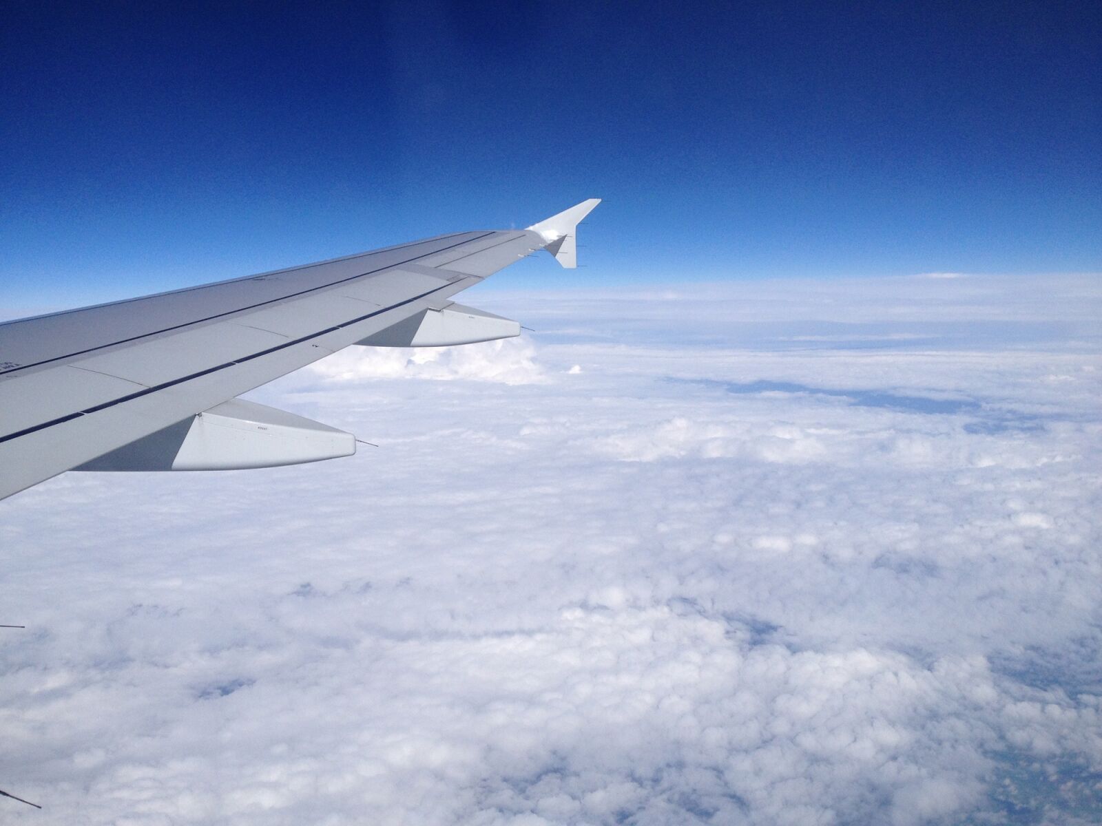 iPhone 4S back camera 4.28mm f/2.4 sample photo. Clouds, sky, plane photography