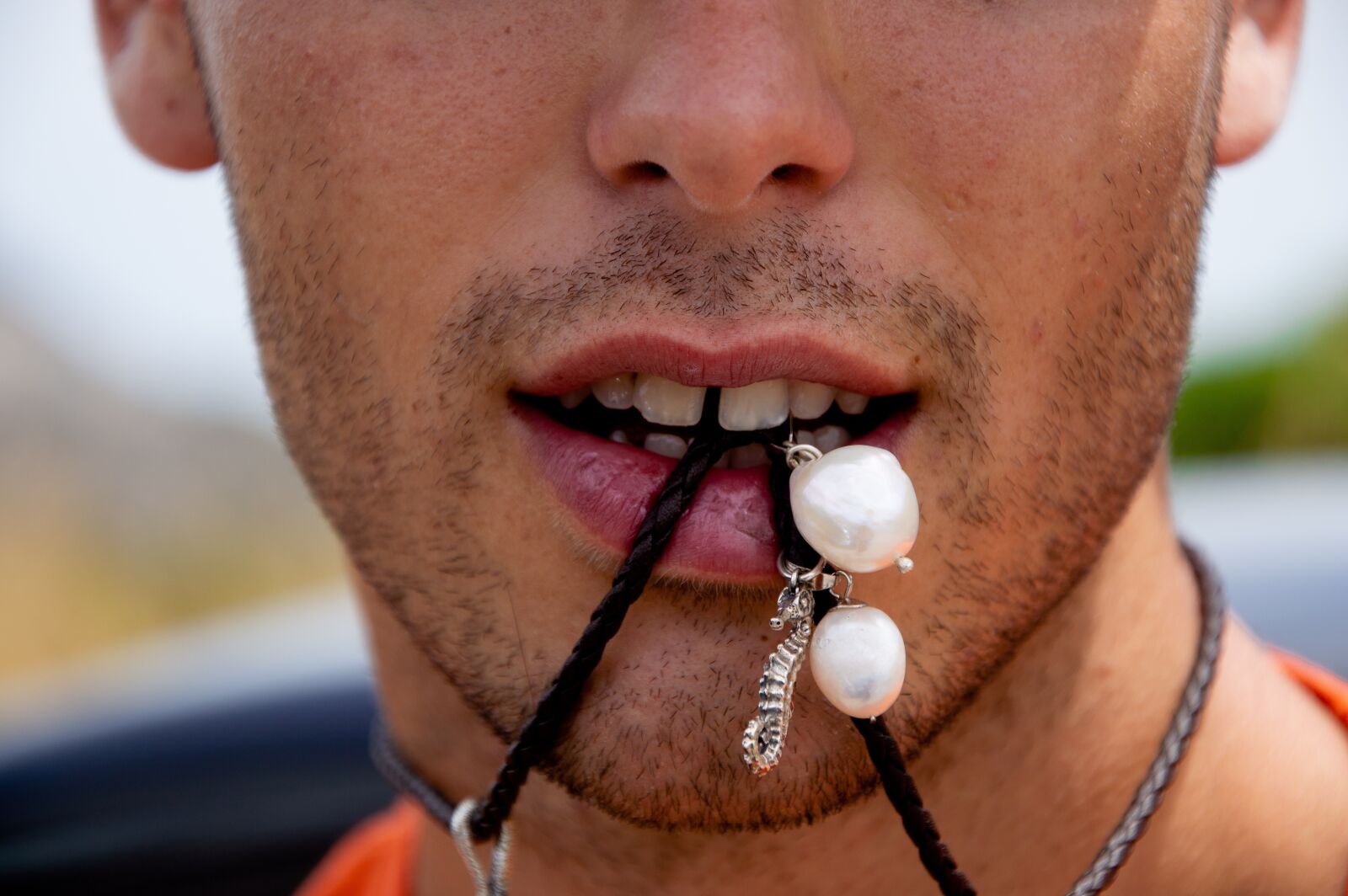 Nikon D3200 sample photo. Guy, necklace, colors photography