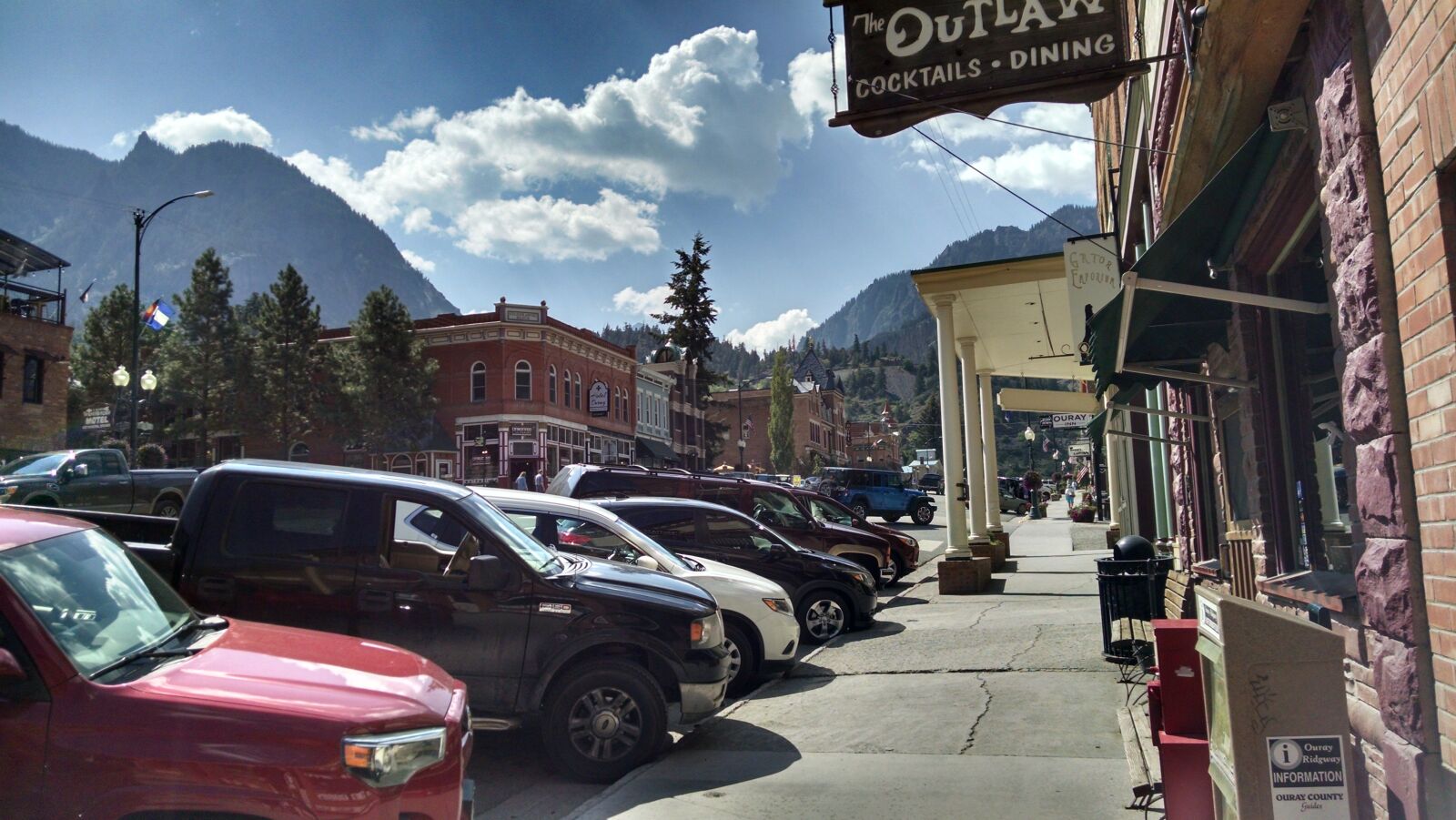 Motorola XT1080 sample photo. Buildings, cars, clouds, mountains photography