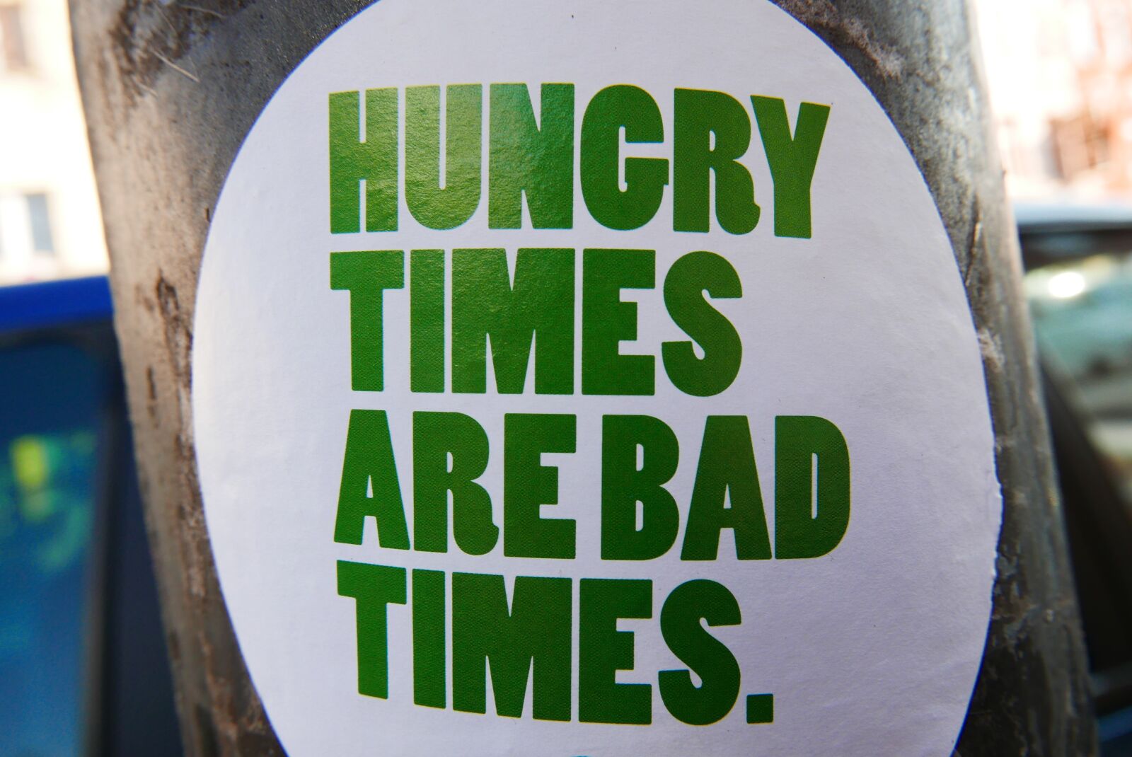 Panasonic Lumix DMC-LX100 sample photo. Sticker, hungry, streetart photography