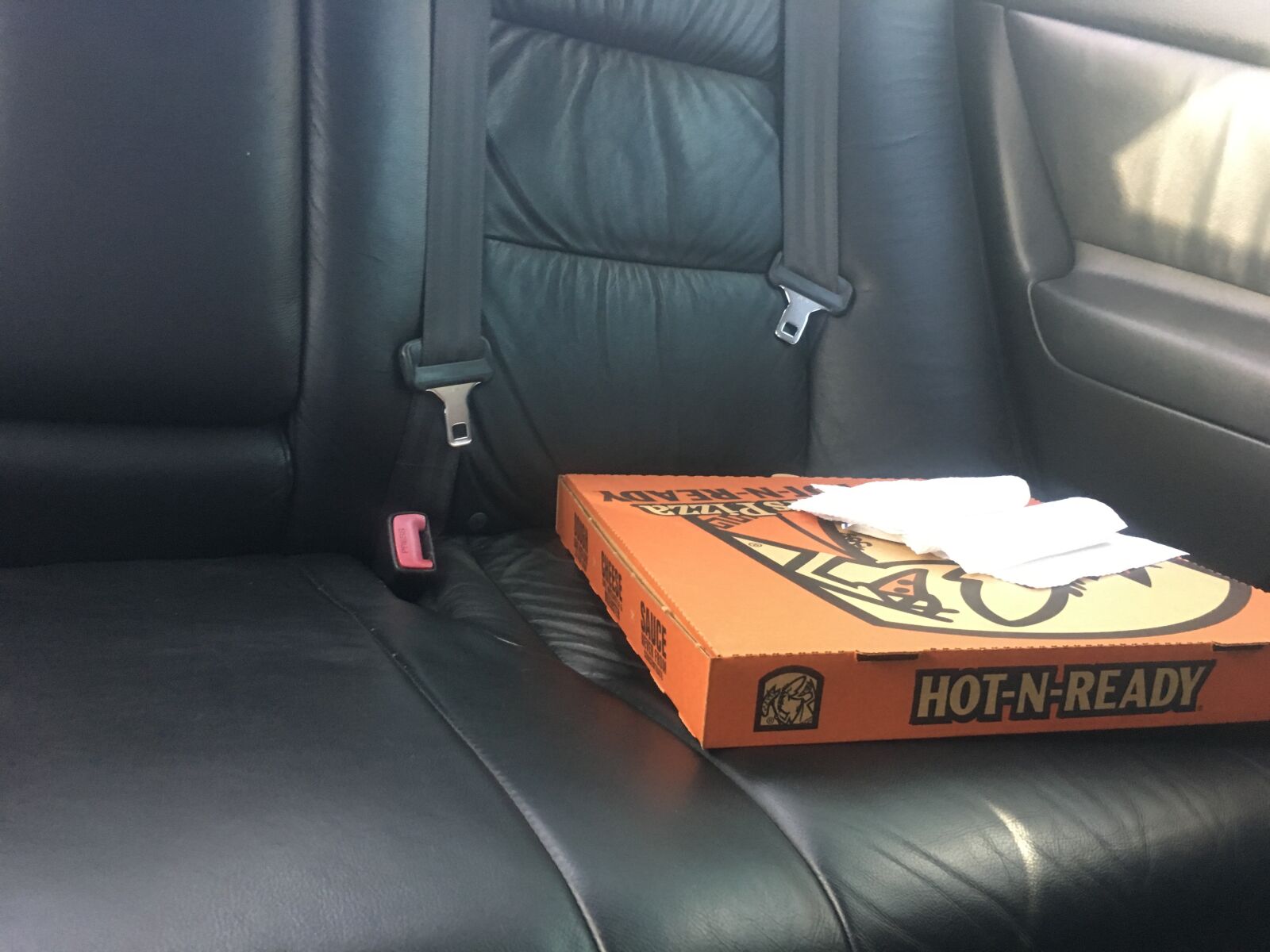 iPhone 6s back camera 4.15mm f/2.2 sample photo. Pizza, car, car seat photography