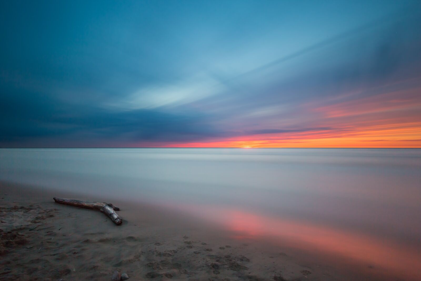 Canon EF 16-35mm F2.8L II USM sample photo. Beach, driftwood, sunset photography