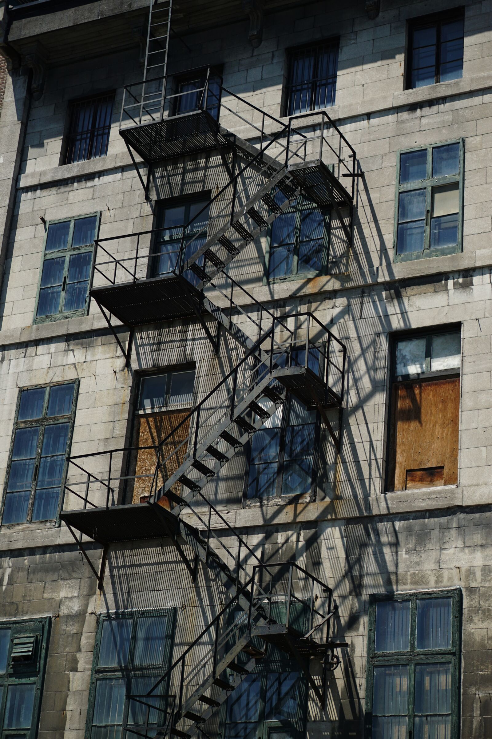 E 50mm F1.8 OSS sample photo. Stairs, shadows, architecture photography