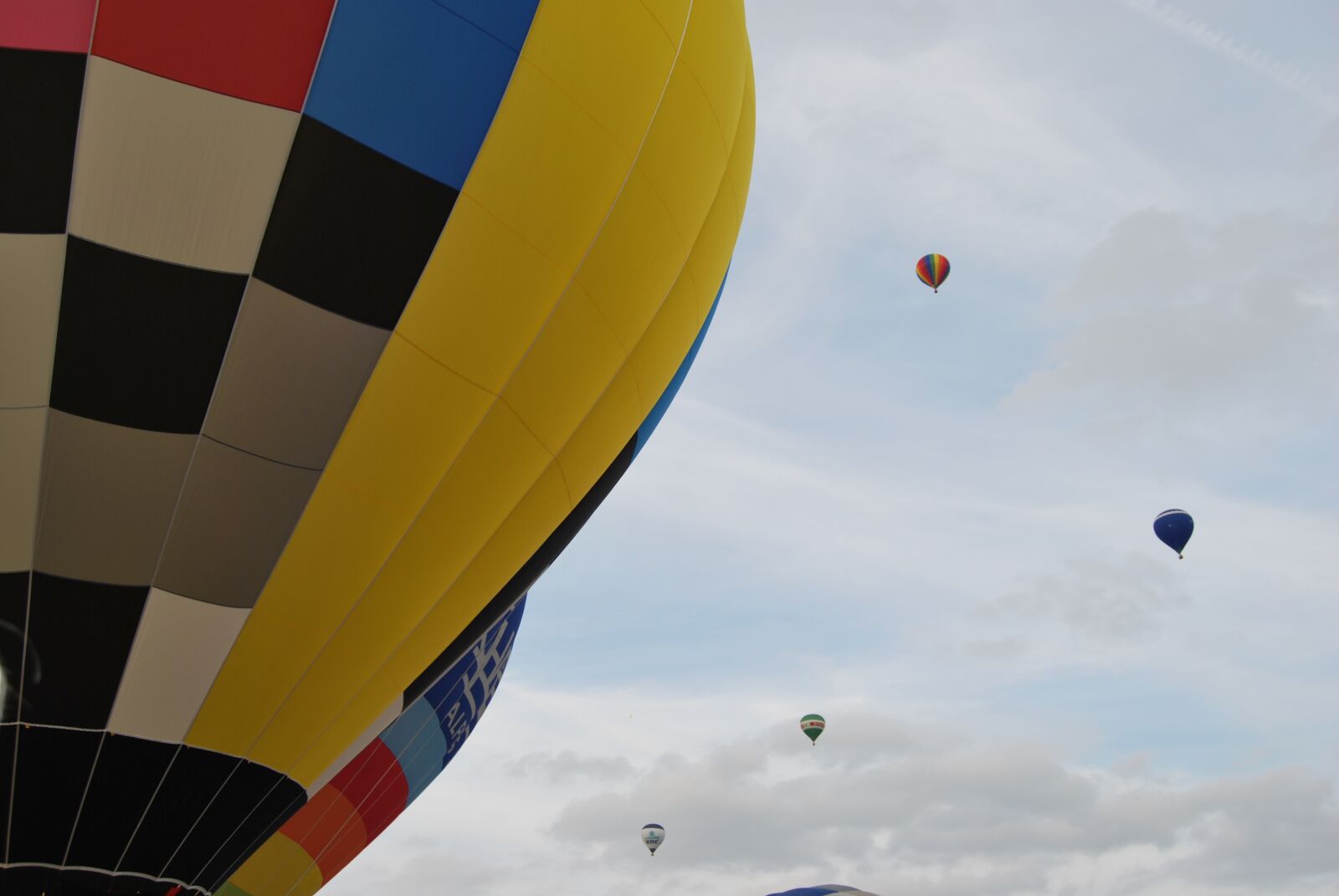 Nikon D60 sample photo. Balloons, clouds, color photography