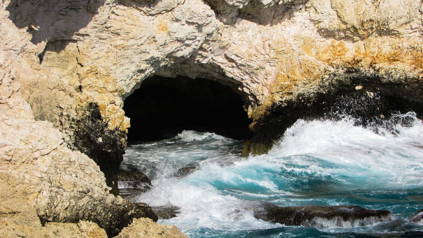 Canon PowerShot SX400 IS sample photo. Sea cave, waves, rocky photography