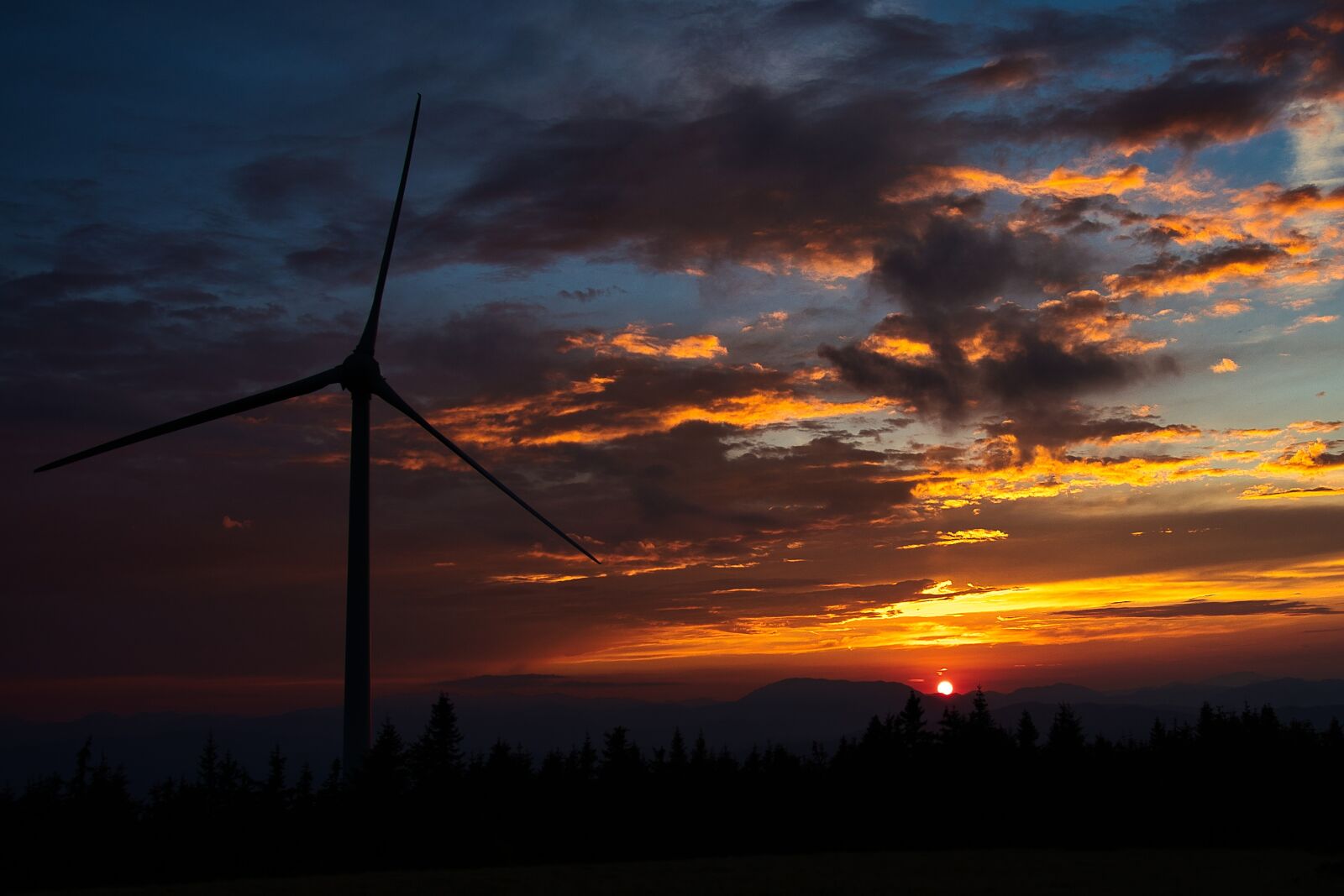 Canon 18-35mm F1.8 DC HSM | Art 013 sample photo. Pinwheel, sunset, wind energy photography