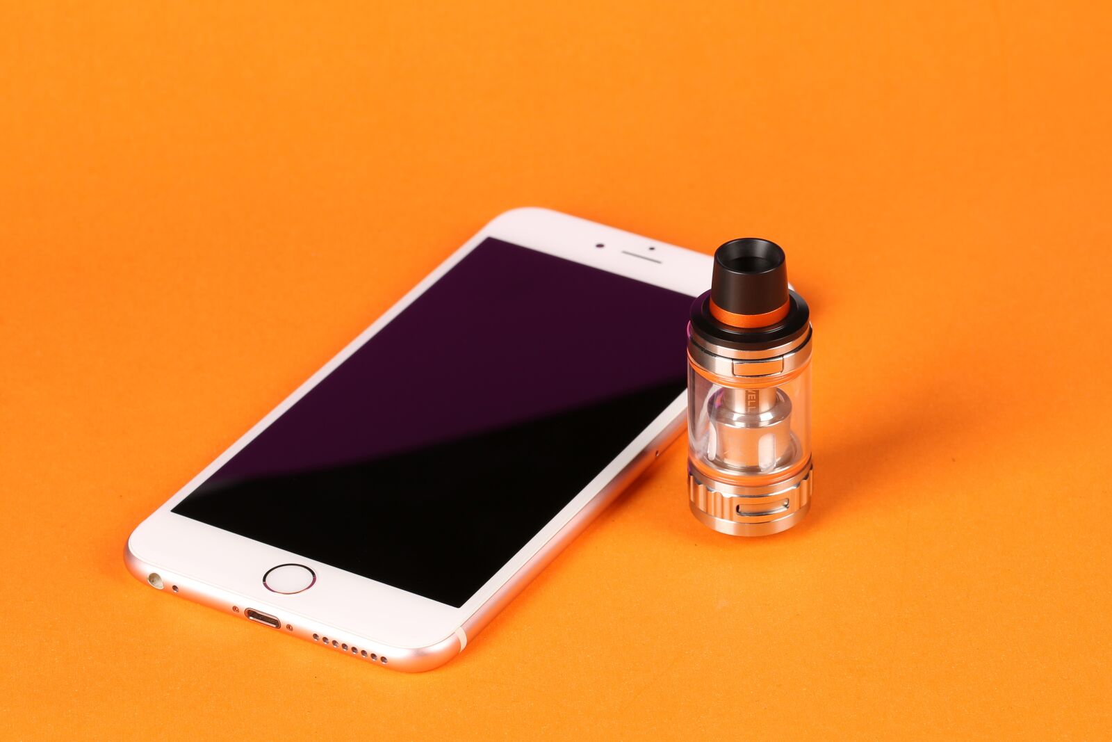 Canon EF 100mm F2.8L Macro IS USM sample photo. Electronic cigarette, mobile, orange photography