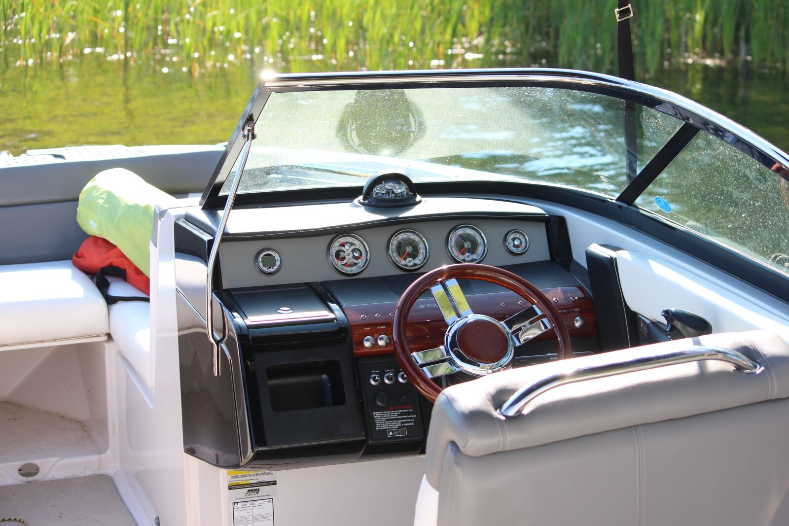 Canon EF-S 55-250mm F4-5.6 IS sample photo. Boat, cockpit, wheel photography