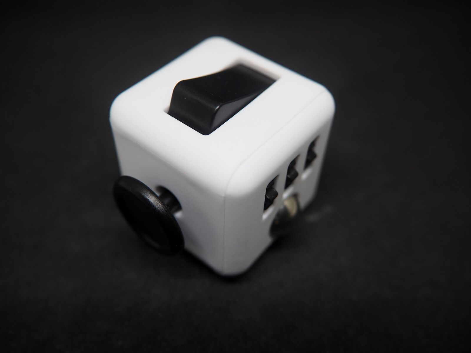 Olympus OM-D E-M10 sample photo. Fidget cube, cube, switch photography