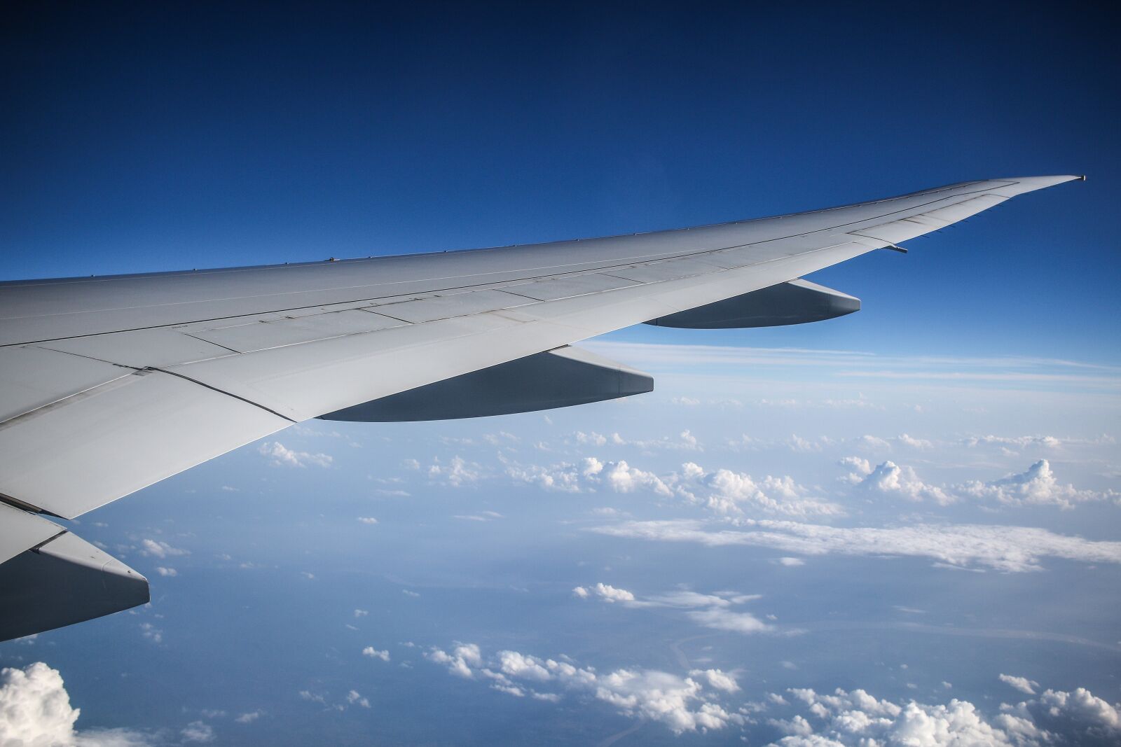 Canon EF-S 24mm F2.8 STM sample photo. Aircraft, wing, clouds photography